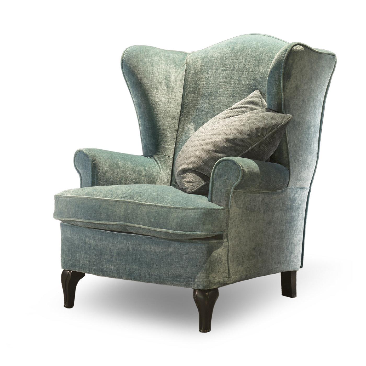 This exquisite reinterpretation of the classic Bergère will impeccably blend in classic or contemporary decors alike. Upholstered in azure fabric (removable) with tone-on-tone piping details, the wooden structure underneath is generously padded in