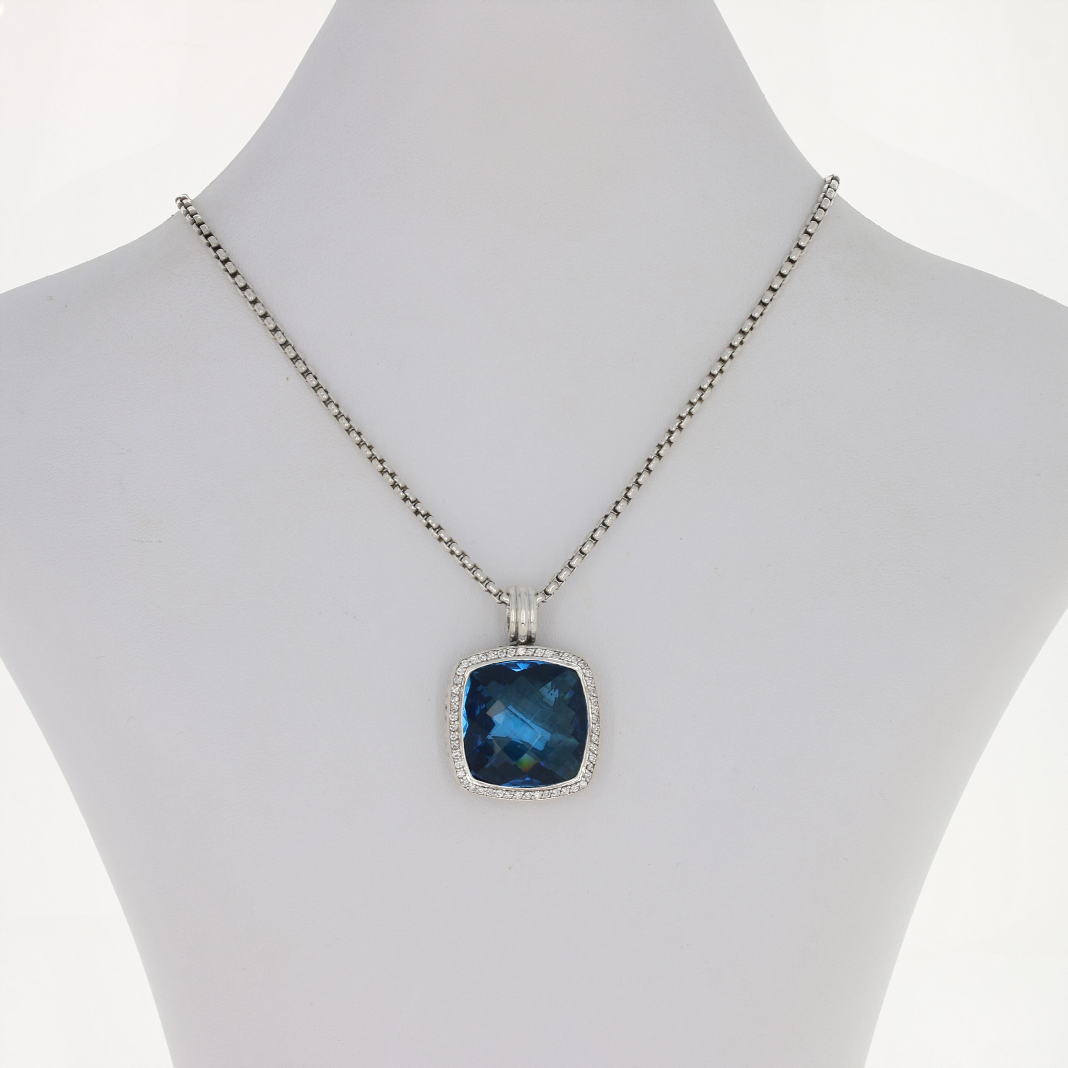 Sparkling like ocean water, this sterling silver piece by David Yurman will be a wonderful addition to your collection! This classic box chain necklace showcases an enhancer pendant adorned with a stunning 20mm Hampton blue topaz framed by a