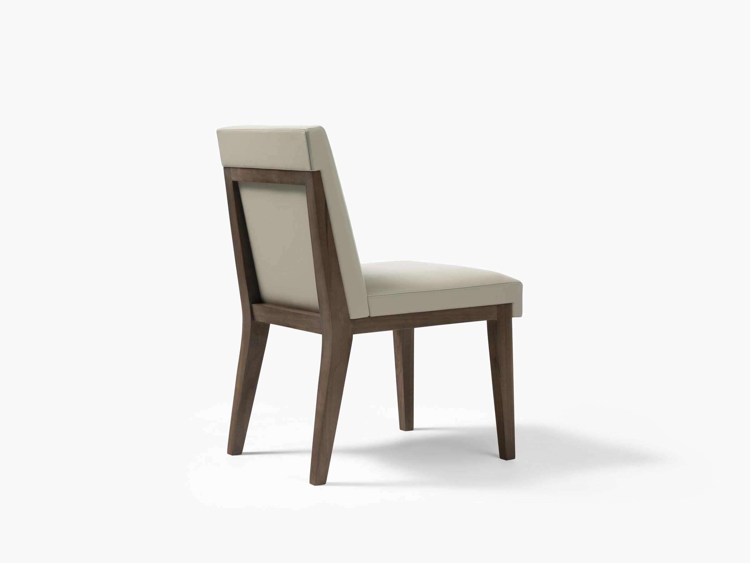 Finely crafted with exceptional attention to detail, the Hampton Dining Side Chair goes beyond the classic dining seat. The upholstery is stitched to interlock with the wood frame, creating a refined and perfectly trimmed look. Its tailored