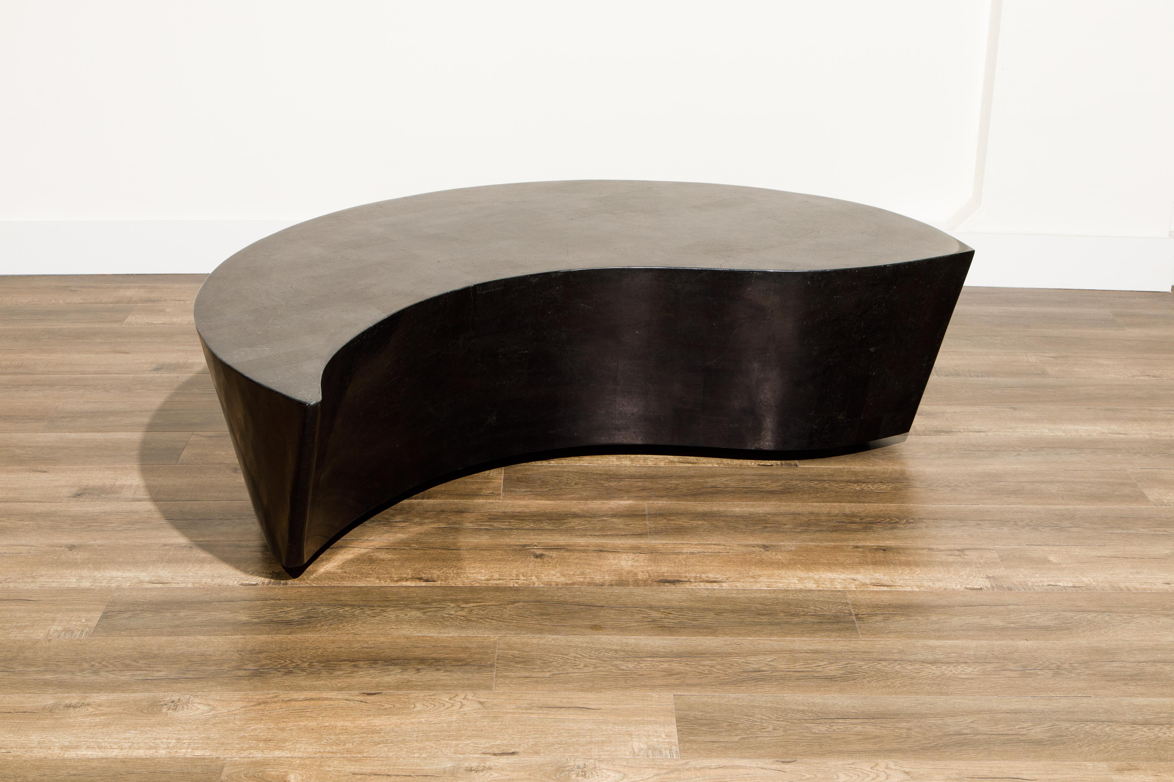 This unique cocktail table is called 'Hampton' by Marquis Collection of Beverly Hills, circa 1990. Constructed with tessellated black stone tiles, this impressive piece would work great with a curved sofa or the Kagan 'Cloud' sofa and can be placed