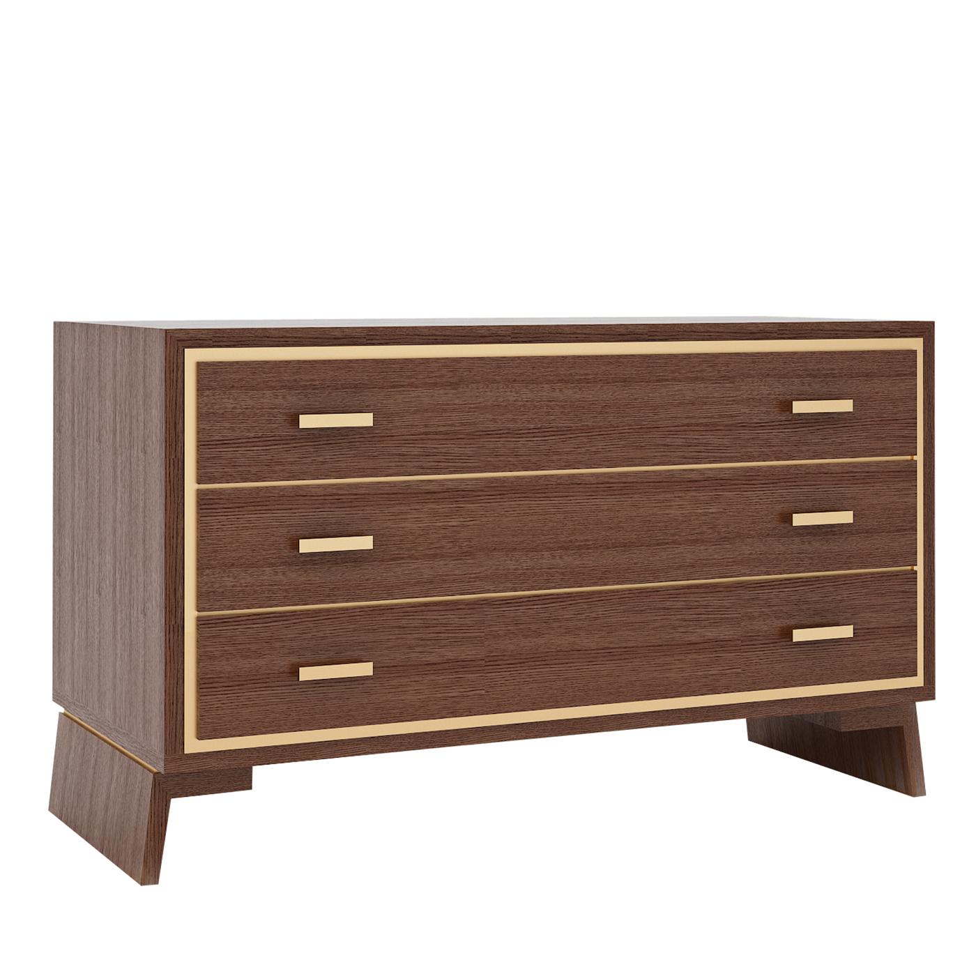 Masterfully crafted using top-quality wood, this exquisite dresser comprises three drawers with two small brass-finished metal handgrips each. A thin metal stripe in the same finish graces the entire frame of the front side, bestowing this piece an