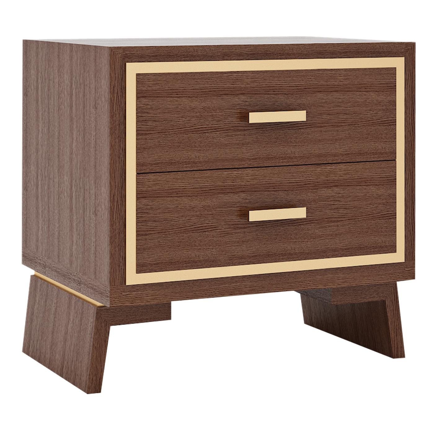 Elegant and restrained lines characterize this wooden variant of the Hamptons nightstand. Two sloped, sturdy legs support the structure that includes two drawers, whose front side is framed by a thin brass-finished metal band. The same finish is