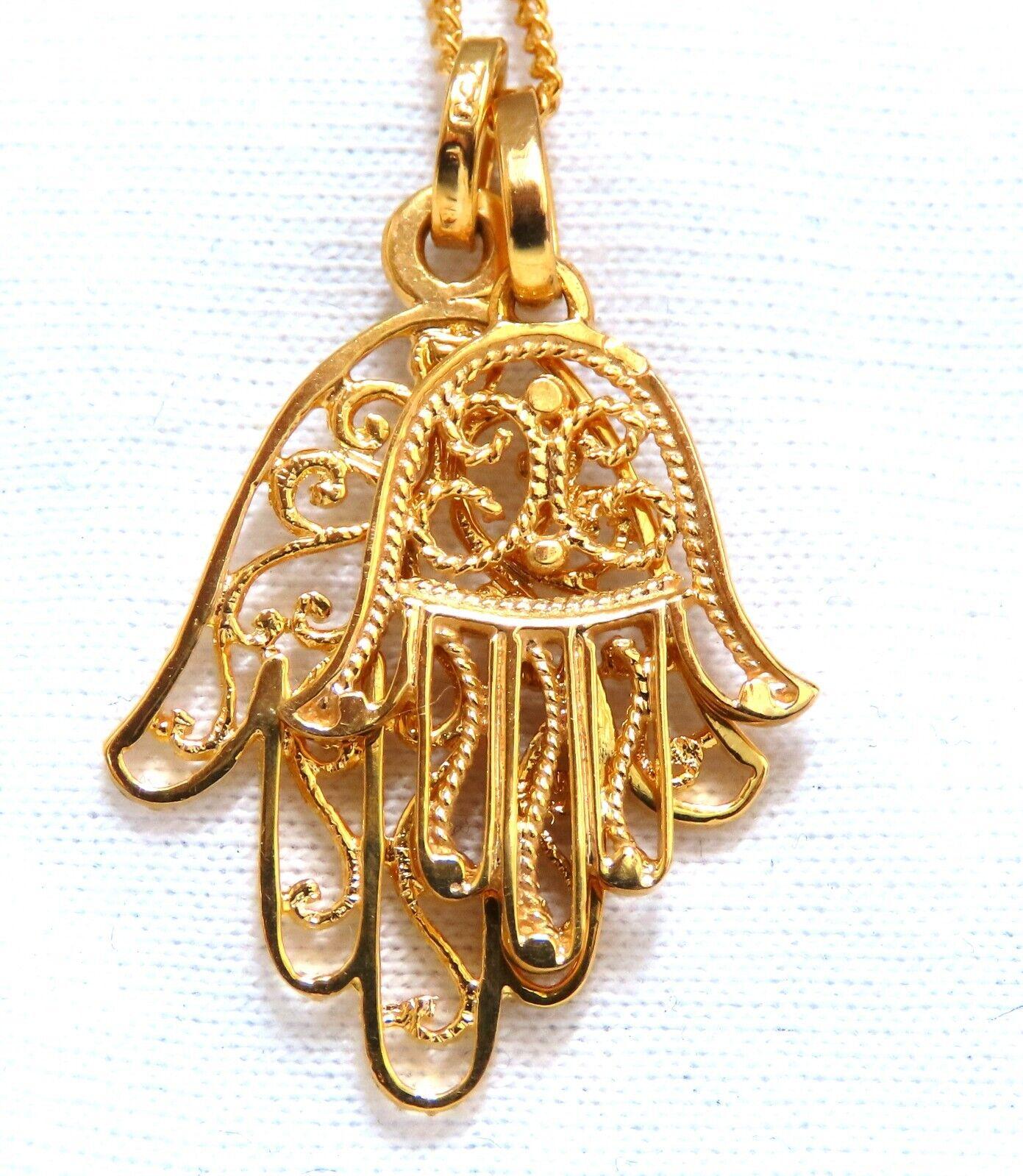 Hamsa double necklace

27 x 18mm

21 x 15mm

19 in Long


18 karat yellow gold