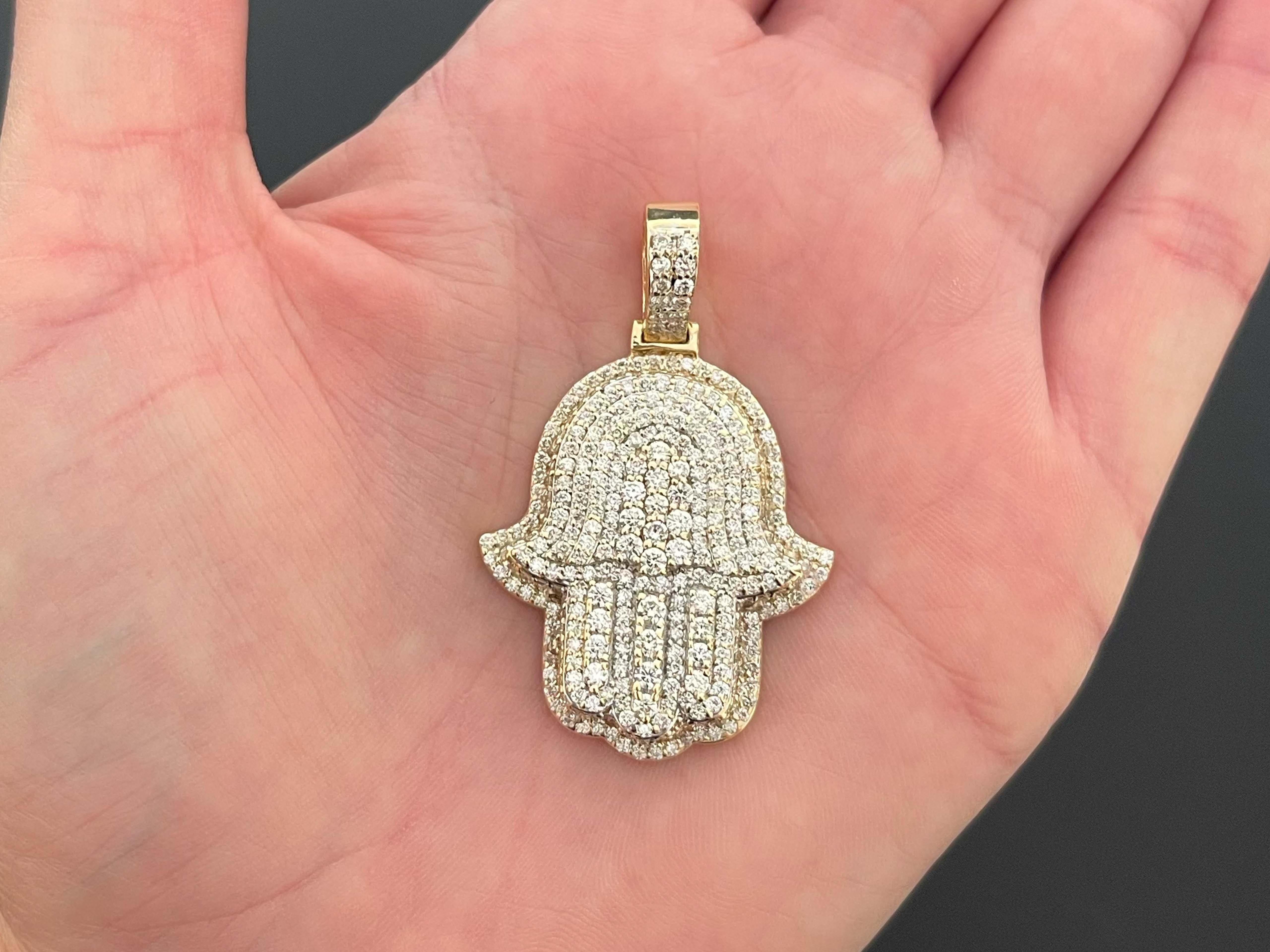 Hamsa Diamond Pendant in 14k Yellow Gold. This stunning pendant is set with ~369 diamonds, sparkling at all angles. The diamonds are G-H in color and VS2-SI1 in clarity. The diamonds weigh a total of 2.53 carats and have amazing sparkle. The pendant