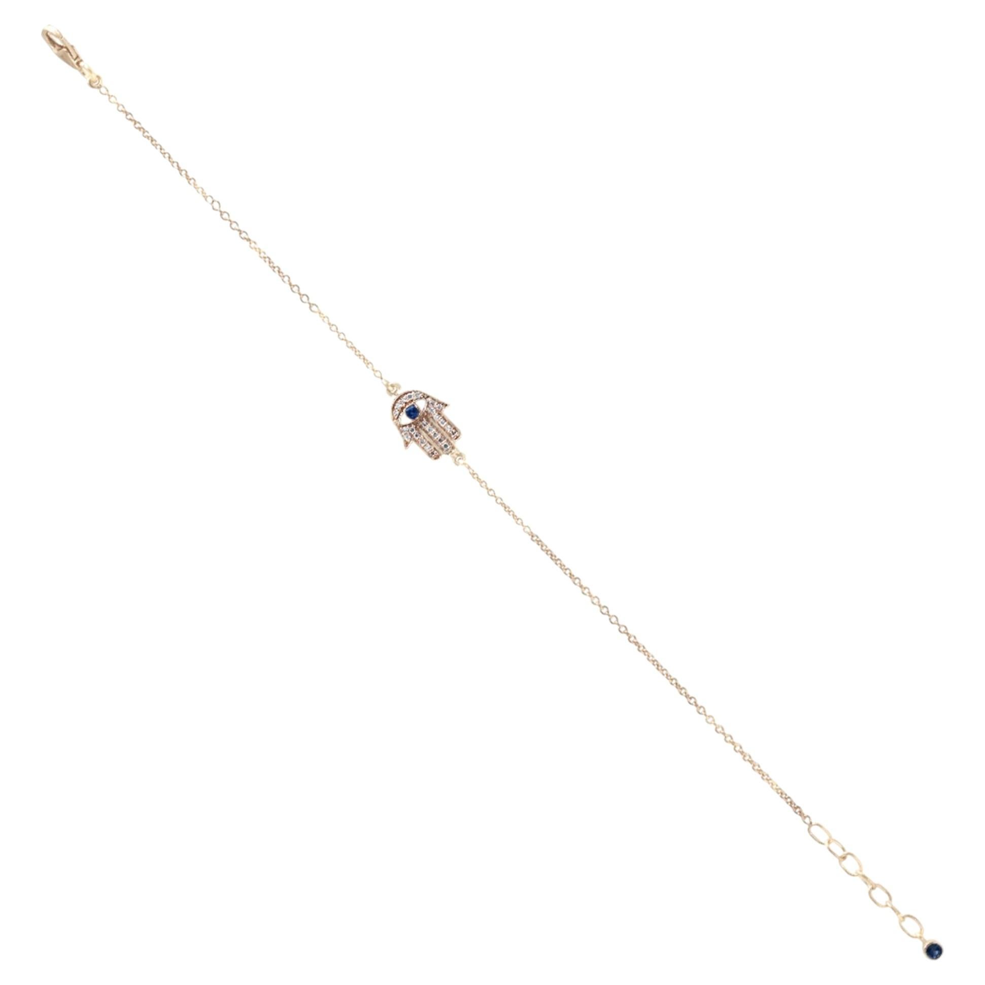 Pulsera con dijes de oro de 14k con mano de Hamsa, zafiro azul y diamantes. Joyería fina en venta