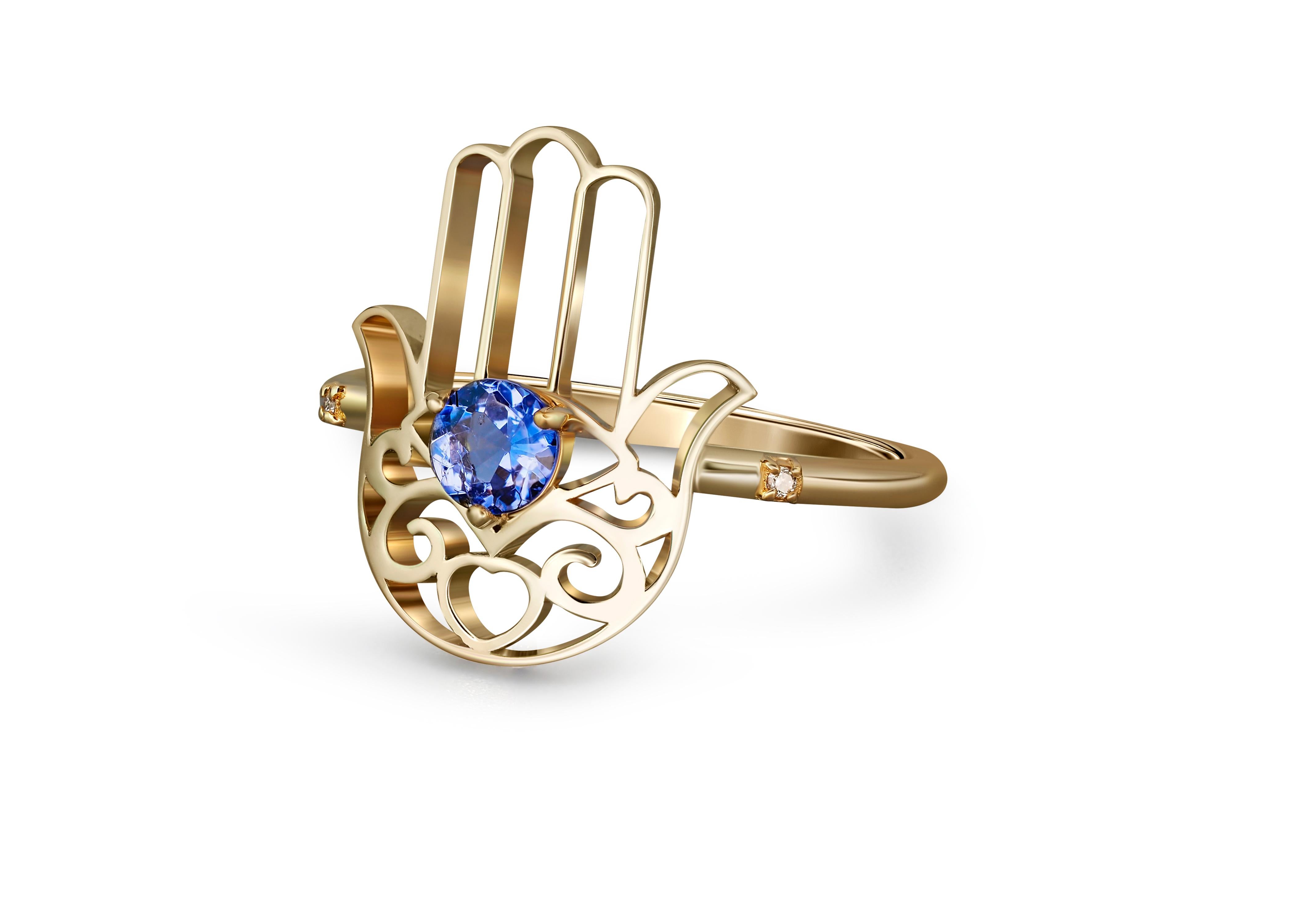 Hamsa Hand Tanzanite ring in 14k gold. 
Hand of Fatima gold Ring. Gold Protection Ring. December Birthstone ring. Round tanzanite gold ring.

Weight: 2 g.
Gold - 14k yellow gold.

Central stone: Tanzanite
Cut: round
Weight: 0.5 ct.
Color: