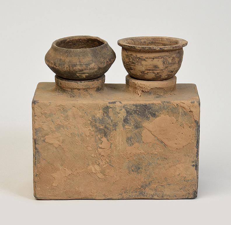 A set of Chinese pottery stove.

Age: Chinese, Han Dynasty, B.C. 206 - A.D. 220
Size: height 18.5 cm / width 9.8 cm / length 19.4 cm.
Condition: Well-preserved old burial condition overall with some amount of soil adhering (some abrasions and