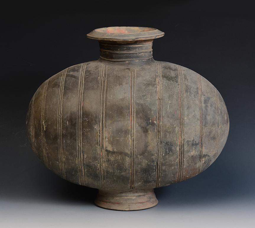 Chinese pottery cocoon jar incised with bands design. 
The cocoon jar is sometimes called a 