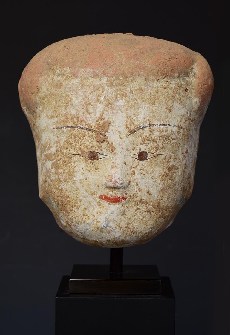 Chinese pottery head of court lady.

Age: China, Han Dynasty, 206 B.C. - A.D. 220
Size: Height 10 C.M. / Width 9.4 C.M.
Size including stand: Height 22.5 C.M.
Condition: Well-preserved old burial condition overall with some amount of soil