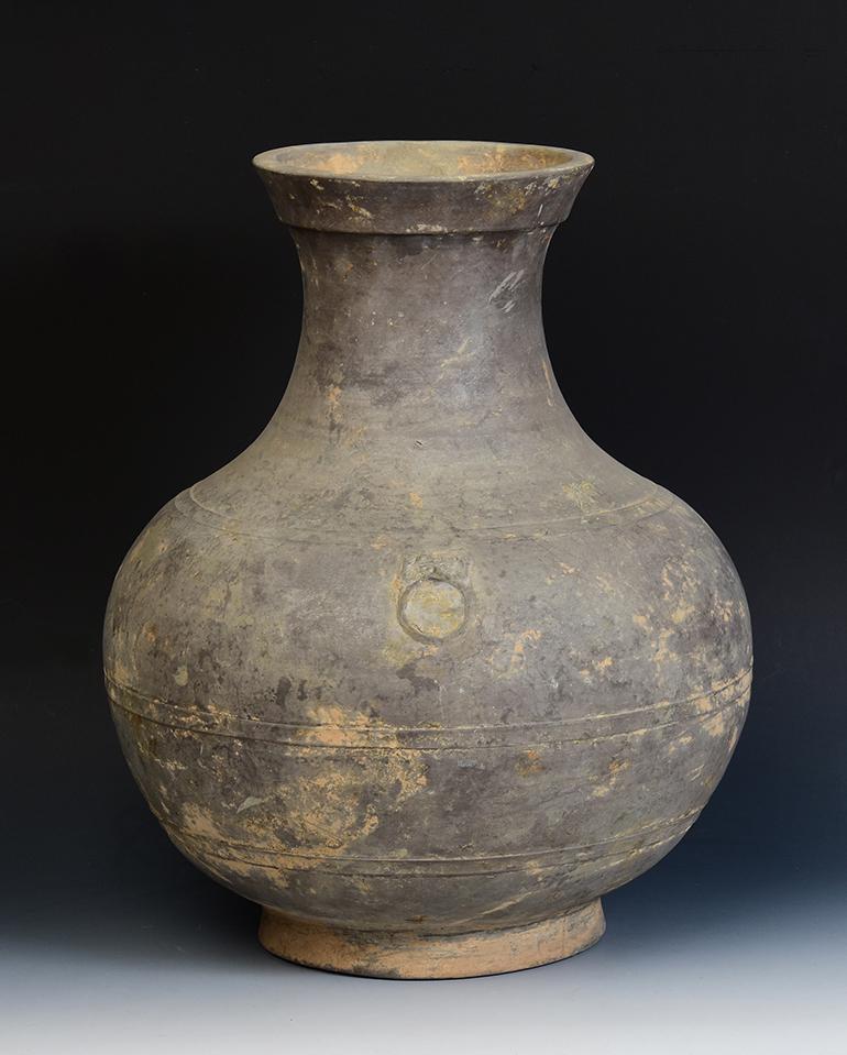 Chinese pottery jar decorated with bands of raised lines and a pair of monster masks on the shoulder.

Age: China, Han Dynasty, 206 B.C. - A.D.220
Size: Height 44.6 C.M. / Width 35.5 C.M.
Condition: Well-preserved old burial condition overall with