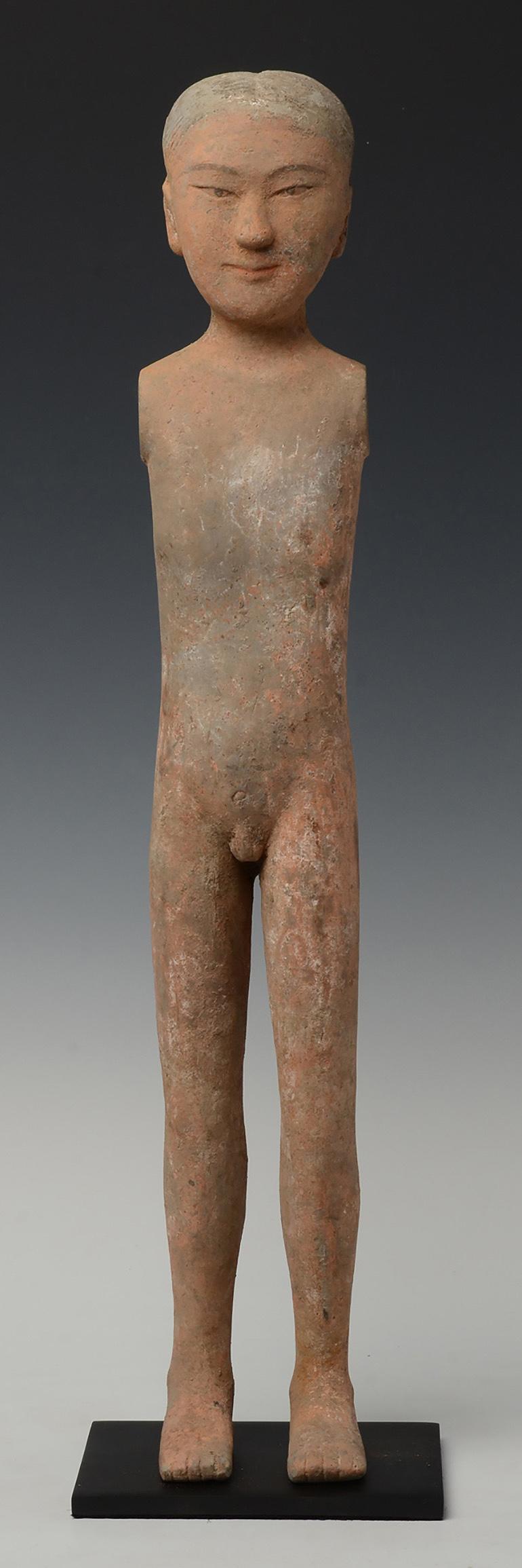 Chinese pottery stick man standing with elongated bodies, legs and no arms, with serene face, traces of original pigments remaining. 

Age: Chinese, Han Dynasty, B.C. 206 - A.D. 220
Size: Height 57.7 C.M. / Width 9.5 C.M. (size excluding