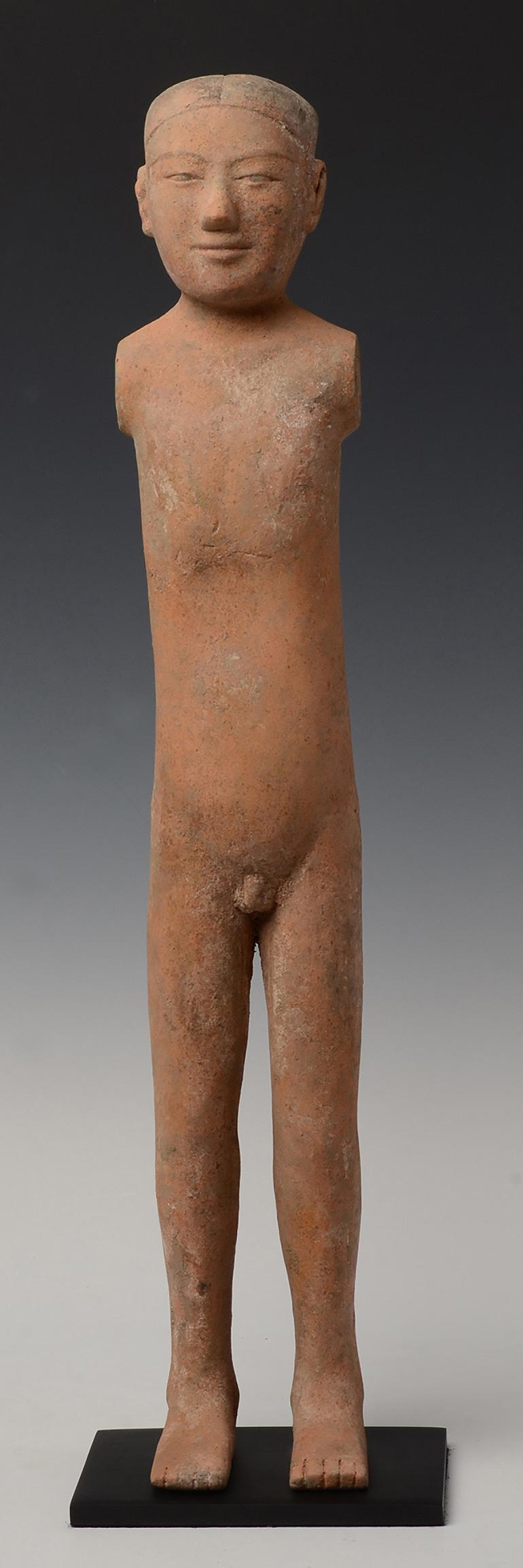 Antique Chinese pottery stick man standing with elongated bodies, legs and no arms, with serene face. 

Age: Chinese, Han Dynasty, B.C. 206 - A.D. 220
Size: Height 57.7 C.M. / Width 10 C.M. (size excluding stand)
Condition: Well-preserved old burial