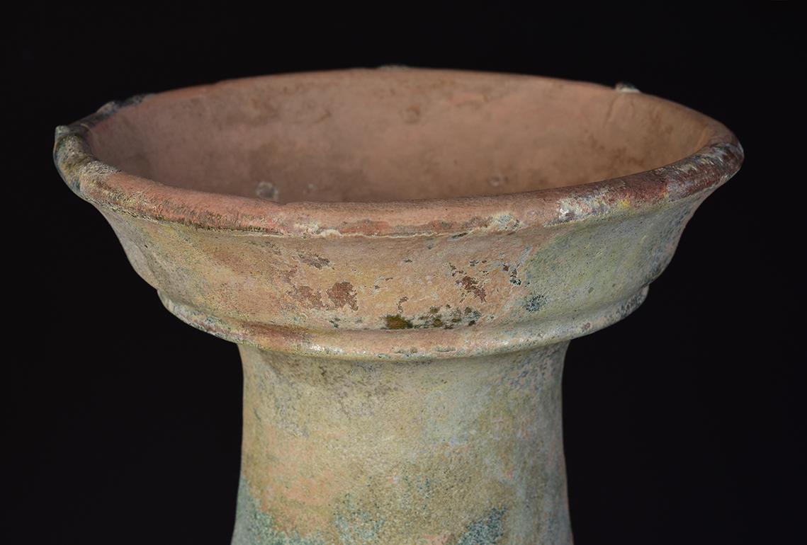 Chinese pottery jar decorated with incised lines on the shoulder.

Age: China, Han Dynasty, 206 B.C. - A.D. 220
Size: Height 41.2 C.M. / Width 25.5 C.M.
Condition: Well-preserved old burial condition overall with some amount of soil