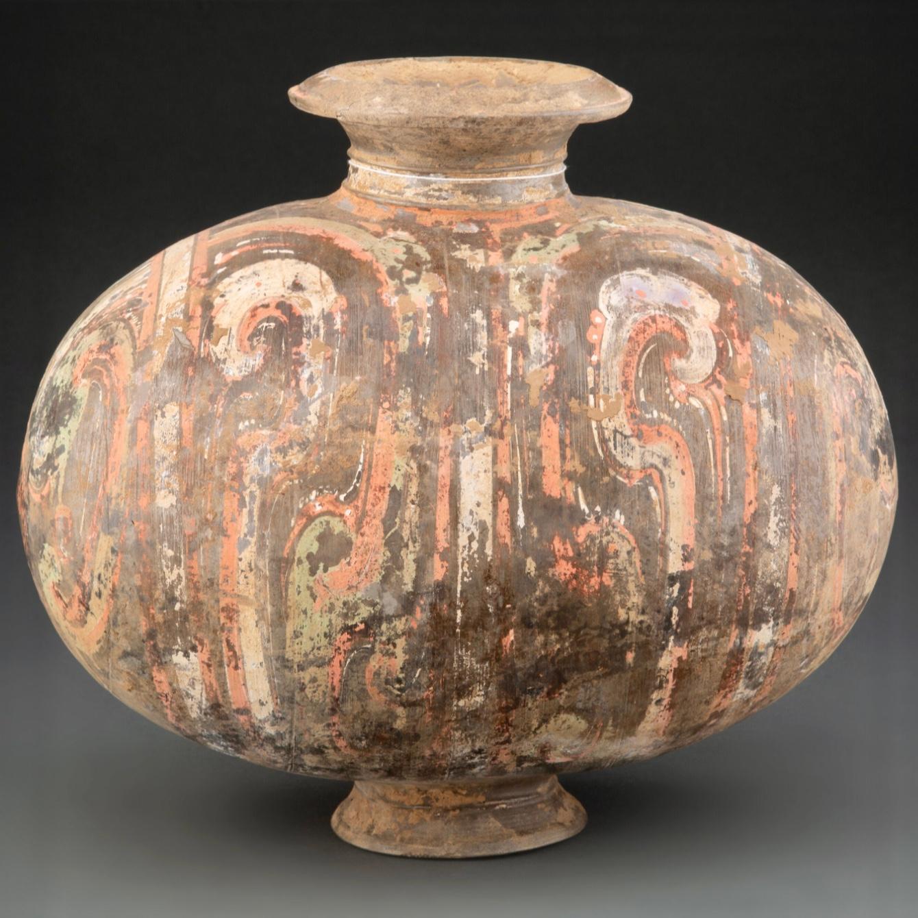 A Chinese pottery Cocoon jar, Han Dynasty
Dimensions: 12.25 x 13 x 8.5 inches (31.1 x 33.0 x 21.6 cm)

This painted earthenware likely was a funerary offering in a Han Dynasty tomb, one of a suite of goods that accompanied the deceased into the