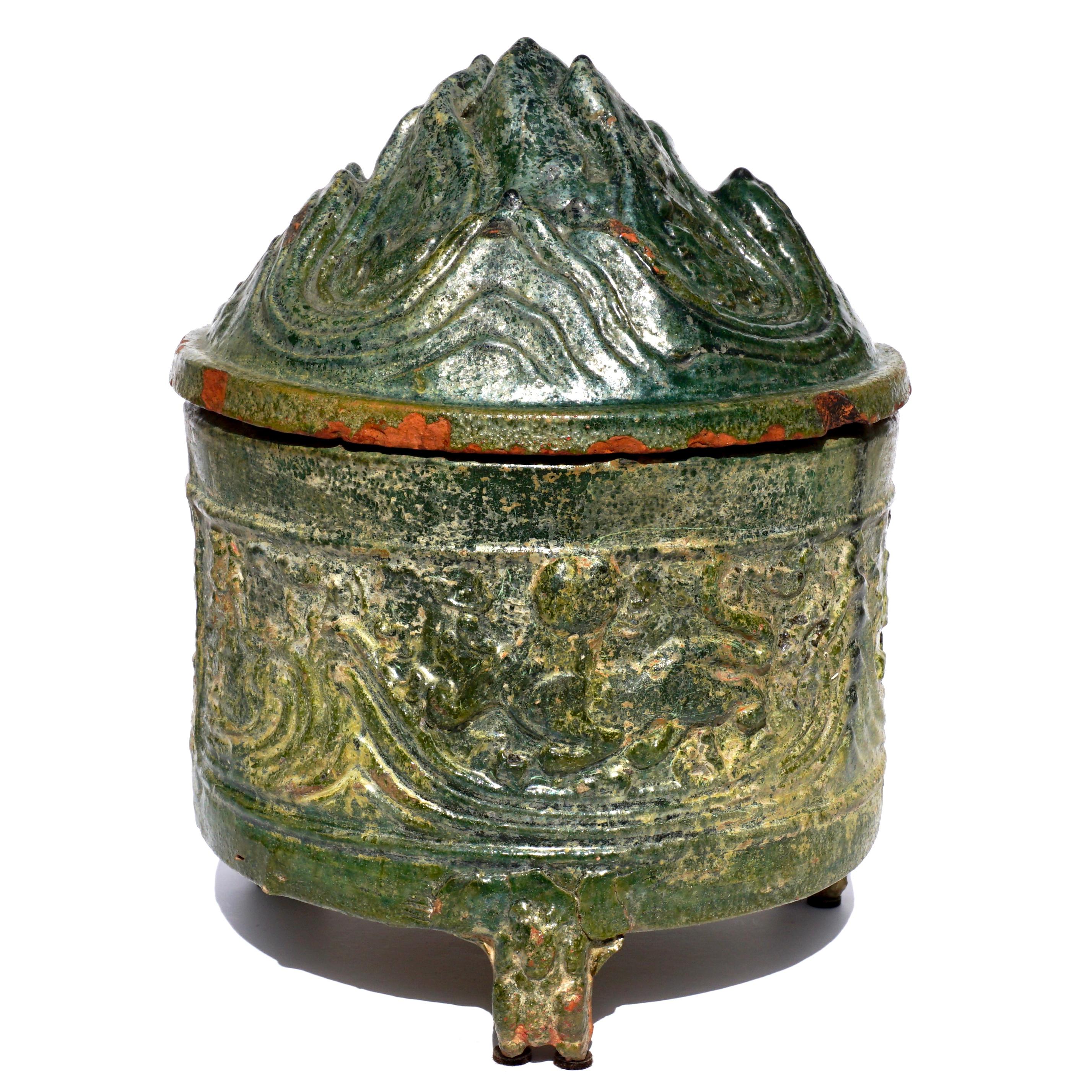 Han earthenware celadon glazed hill jar

The hill jar represents the five scared mountains which is the path between the earth and paradise. The scared mountains are filled with animals that live there.

This jar might also represent either Mount Bo