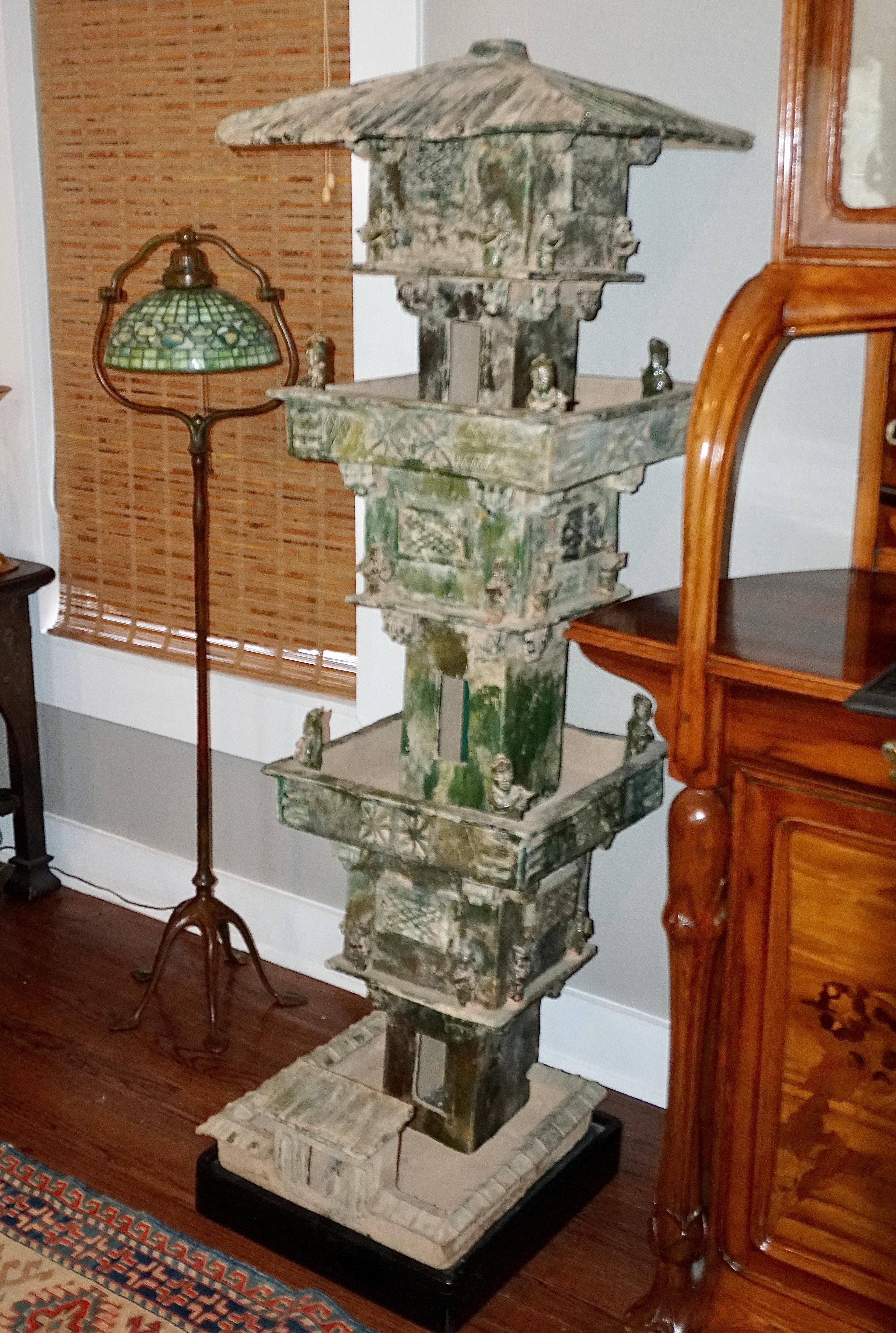 Monumental Pottery Watch Tower in Green Glaze; Han Dynasty (2016 BC -AD 220) 

Earthenware three-storied pavilion from the Eastern Han Dynasty. Each of the three sections have two levels making it a six level tower. All levels have archers with