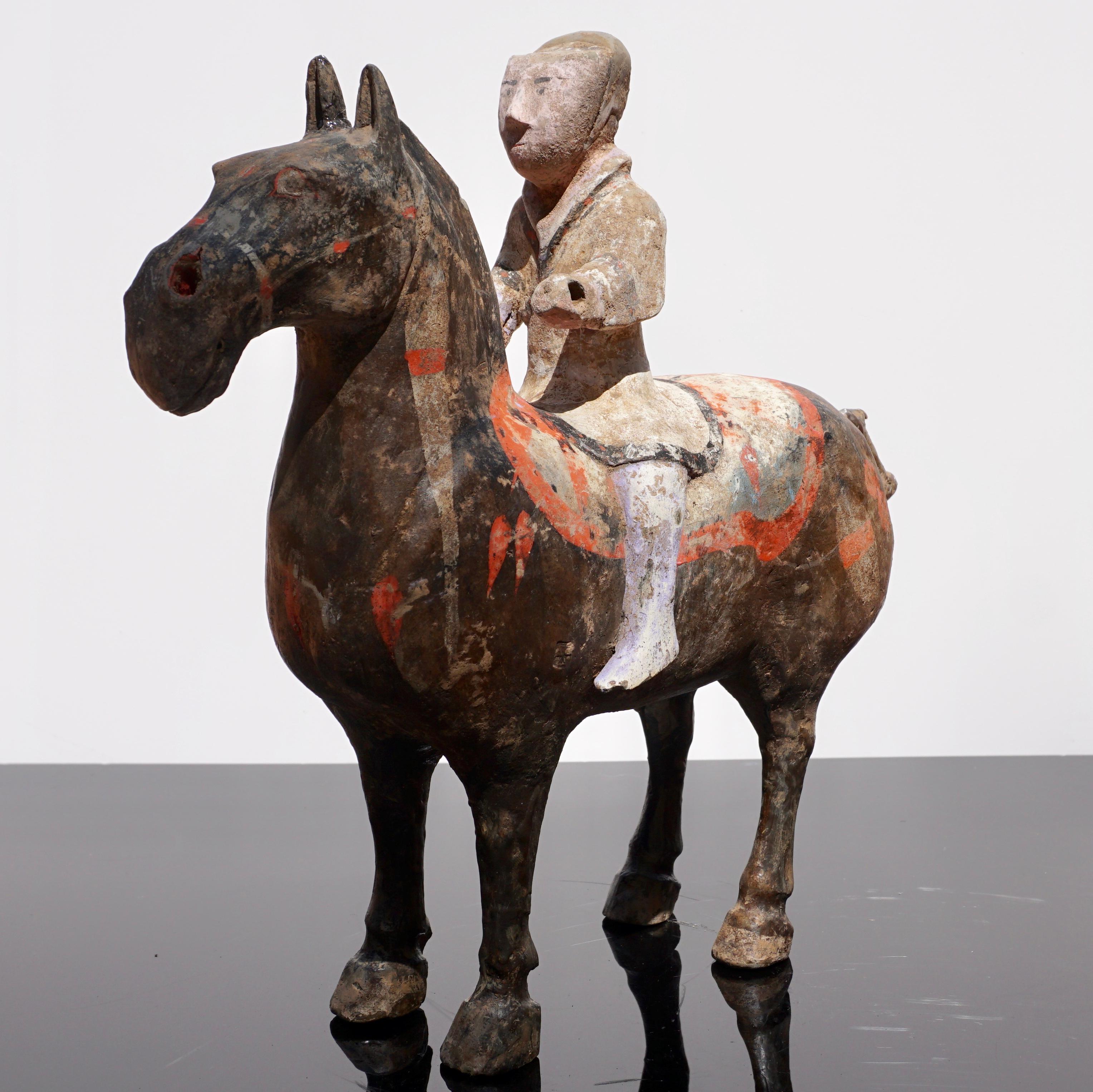A Chinese painted grey pottery horse and rider, Shaanxi province. These tomb statues were common for over a thousand years and were to accompany the deceased in the afterlife for those who were affluent.

Western Han dynasty (206 BC-220 AD)
 
The