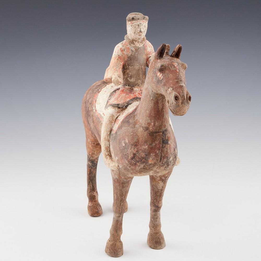 Han Dynasty Horse Sculpture, 206 BC- 209 AD

It is interetsing to note the position of the riders feet. They are gripping the shoulder of the horse. Double riding stirrups were not used in China until the 4th century when the deployment of cavalry
