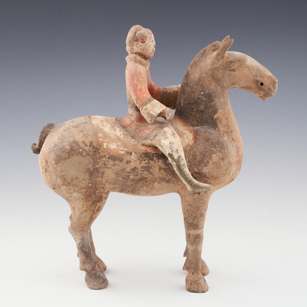 Han Dynasty Horse Sculpture, 206BC- 209 AD

It is interetsing to note the position of the riders feet. They are gripping the shoulder of the horse. Double riding stirrups were not used in China until the 4th century when the deployment of cavalry