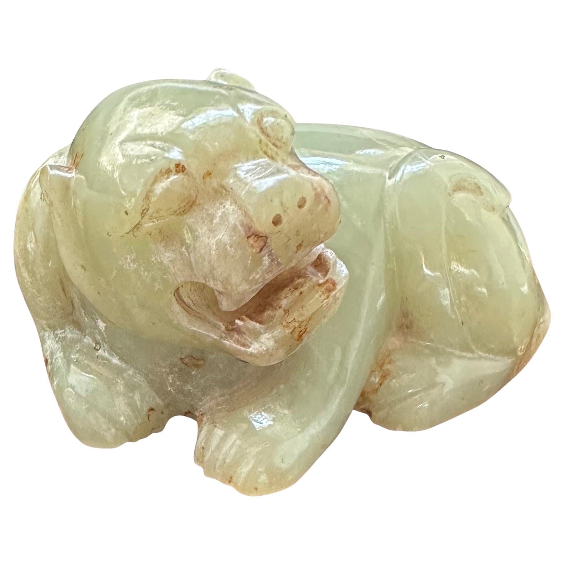 Six Dynasties (220 A.D. to 589 A.D.) winged lion carved in green jade. This piece was exhibited at the Bauer Collection in Geneva, Switzerland (Nov. 11, 2020 to May 23, 2021) and the Musee Des Arts D'Extreme Orient in Nice, France (June 12 to Sept.