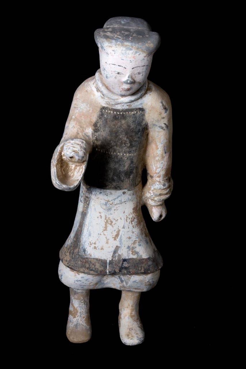 Terracotta standing soldier holding a spear or lance with his right arm, with remains of original polychrome painting over the stucco. This beautiful piece is accompanied by a European Passport, “Certificate of Authenticity”, European Cultural Goods