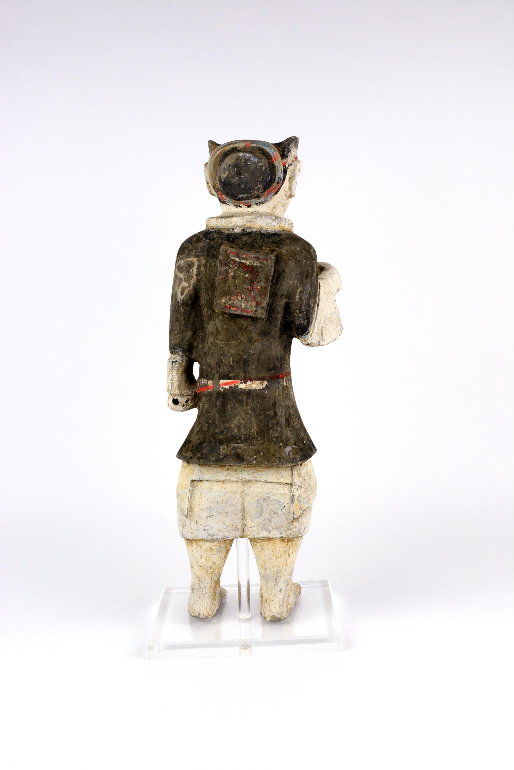 Han Warrior
Unlike Qin terracotta, Han Dynasty pottery figurine/ sculptures convey a more subdued and non-aggressive look. The figurines are clothed with bright pigments of red, blue, green and black. The proportion and expression are a good