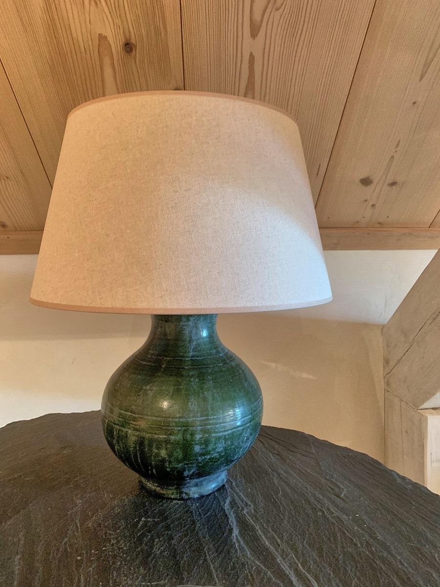 A 19th century glazed green Han style pot turned in to a table lamp. The pot with beautiful proportions and an attractive patina.