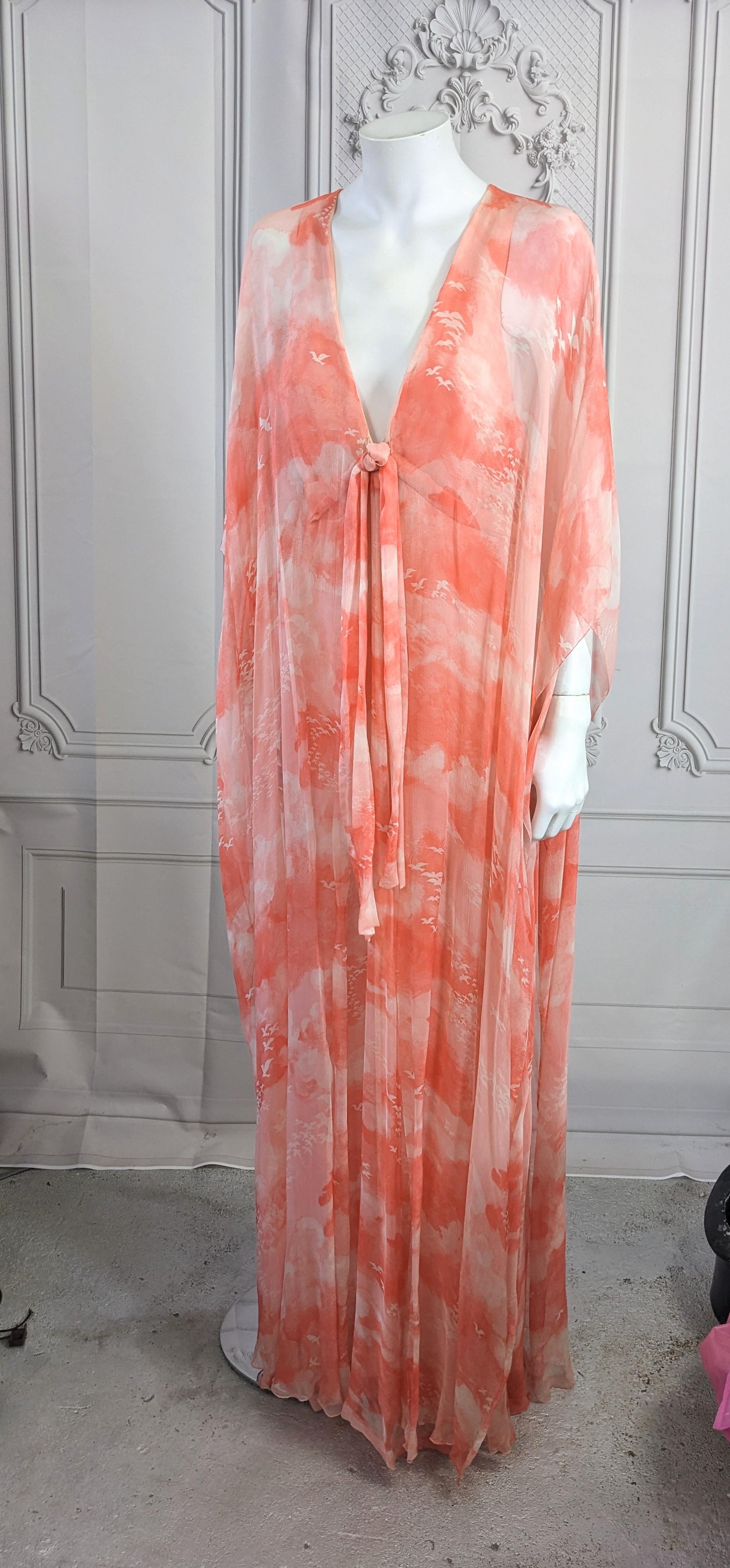 Floaty Hanae Mori Haute Couture Chiffon Caftan Gown from the 1980's. Signature, dreamy cloud and sea gull silk chiffon print is used for a caftan attached to a halter style dress underneath. 
Sheer poncho floats over under dress. Deep V neckline