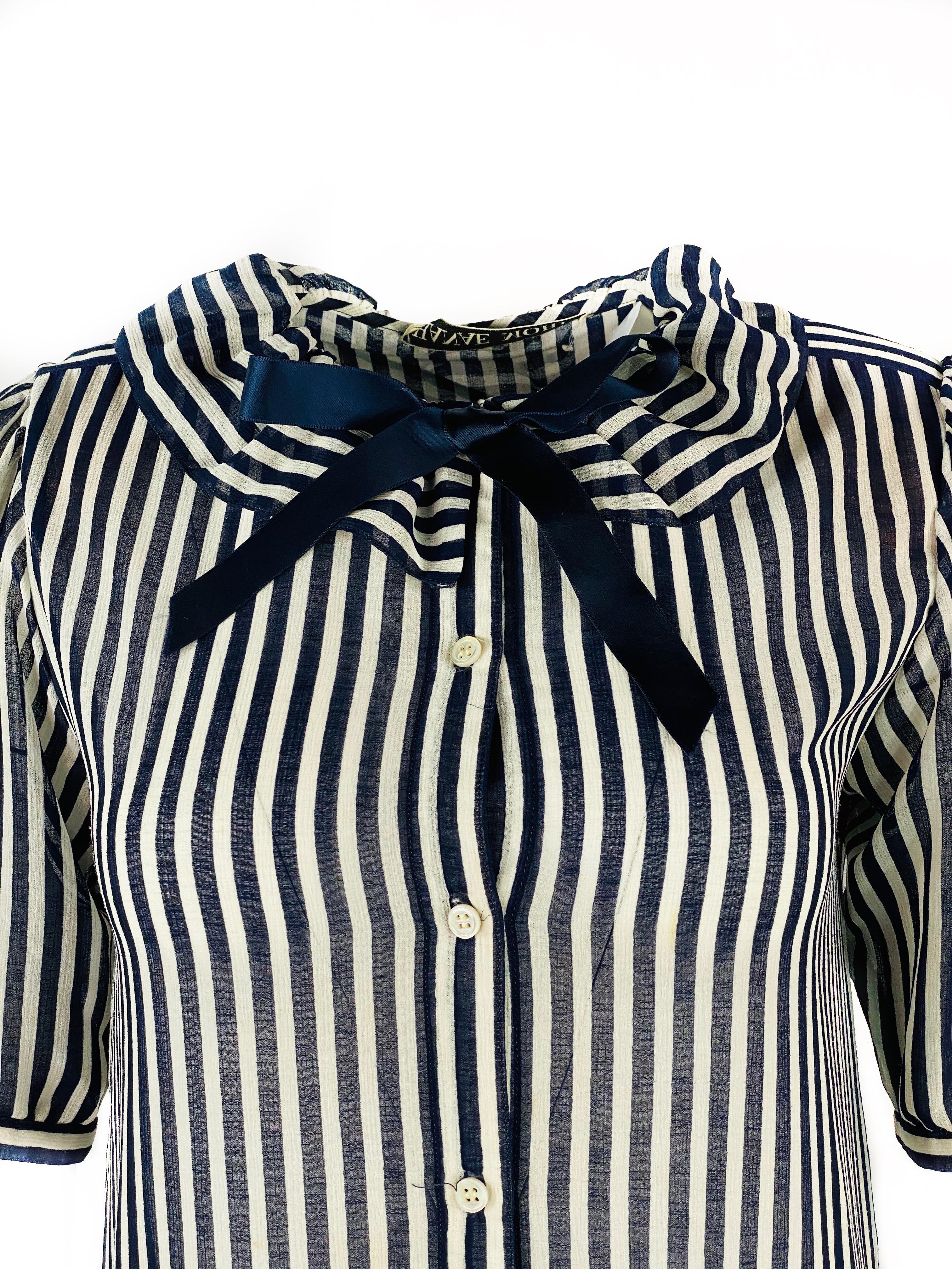 HANAE MORI Navy and White Striped Short Sleeve Midi Dress w/ Bow Size US 8

Product details:
Size 8
100% Polyester 
Short sleeves 12.5” long
Four front button and one hook front closure
One button rare closure on each sleeve
Featuring navy bow