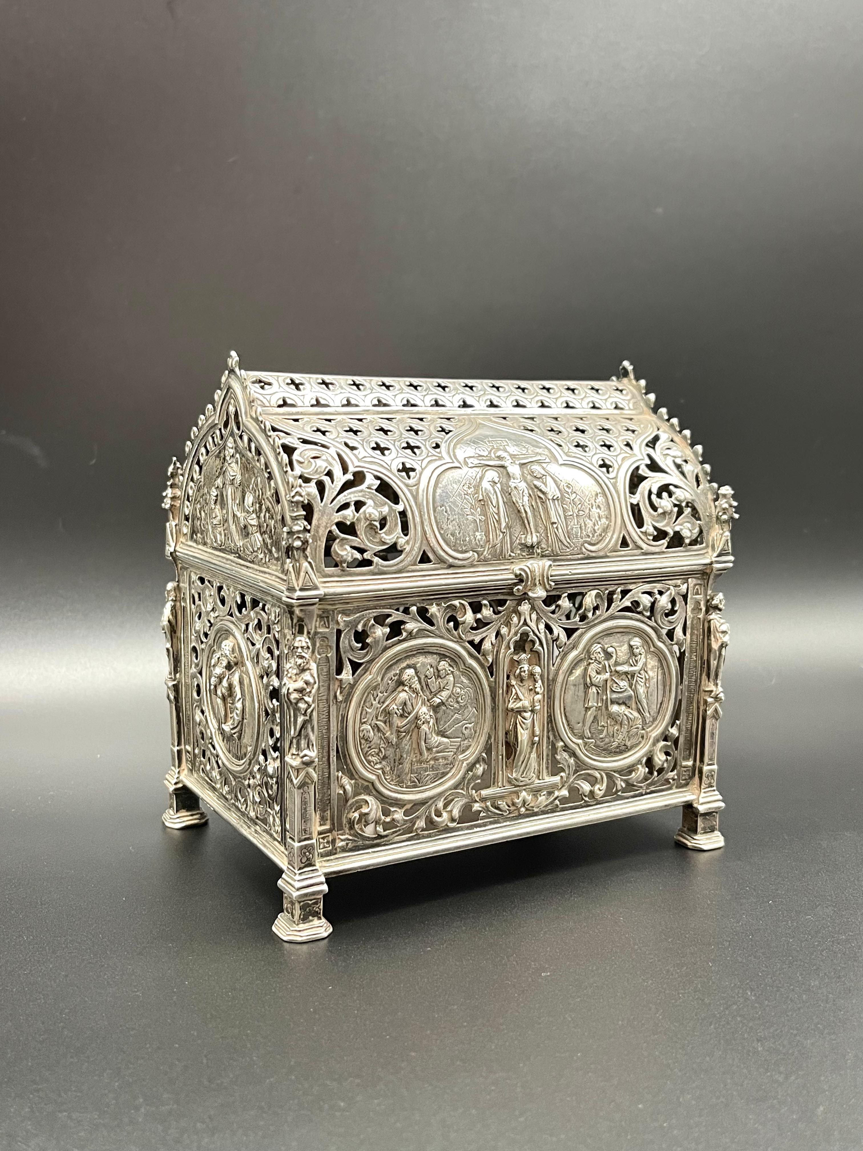 A Magnificent, fine and impressive Silver Reliquary Casket made by the Famous Neresheimer & Söhne with Representations of the life of Christ and Saints. An antique silver casket with hinged lid and decorative finial. 

A Stunning handcrafted