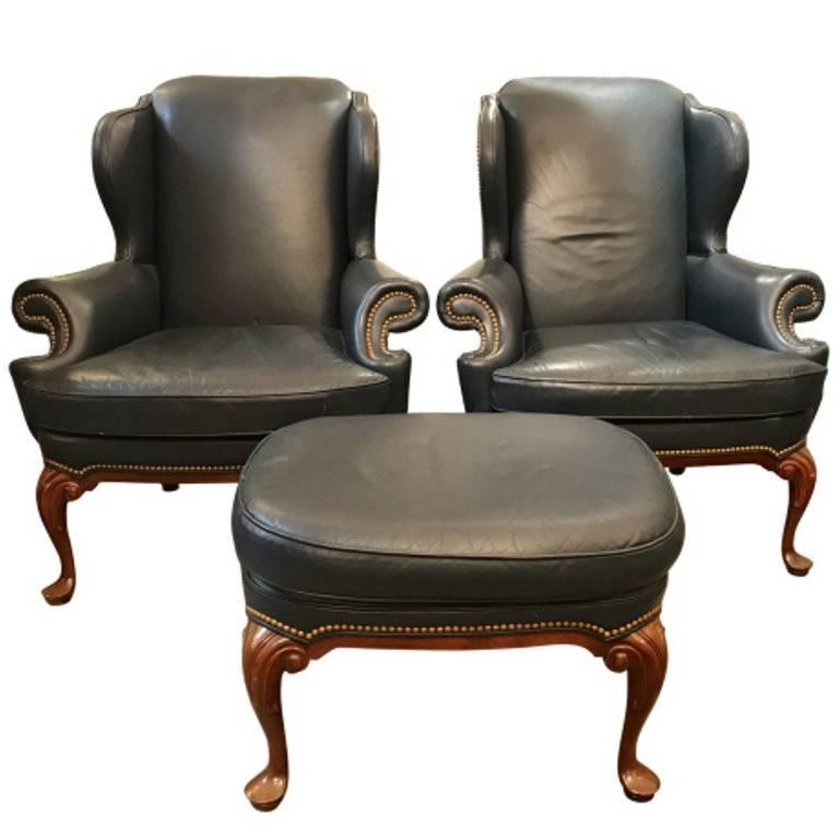 Hancock and Moore Two Wing Chairs and Ottoman