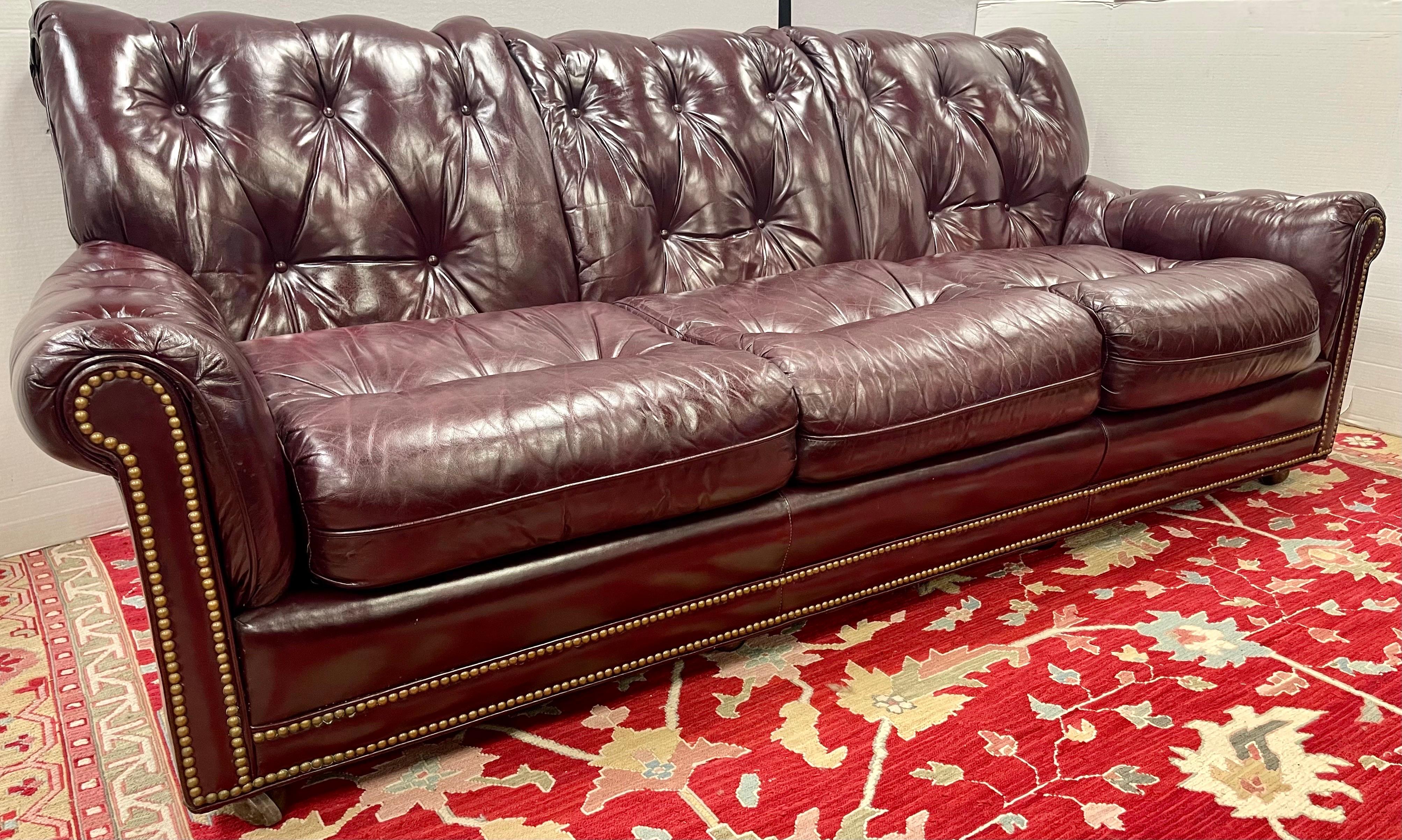 Classic Hancock & Moore cranberry leather three seater sofa measuring 86