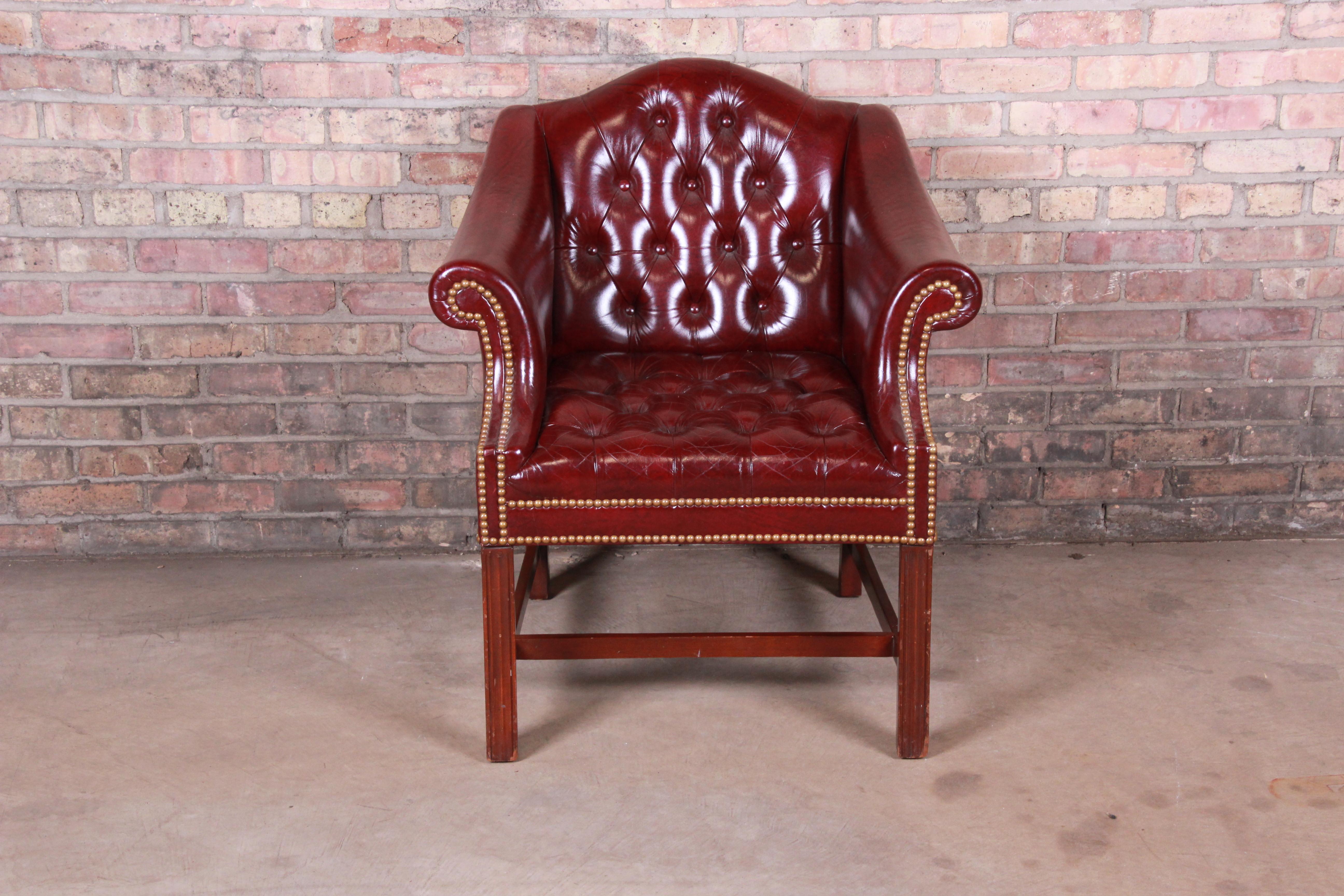 A gorgeous Chesterfield style club chair

By Hancock & Moore

USA, circa 1980s

Tufted burgundy leather with brass nailhead trim and mahogany frame.

Measures: 29.5
