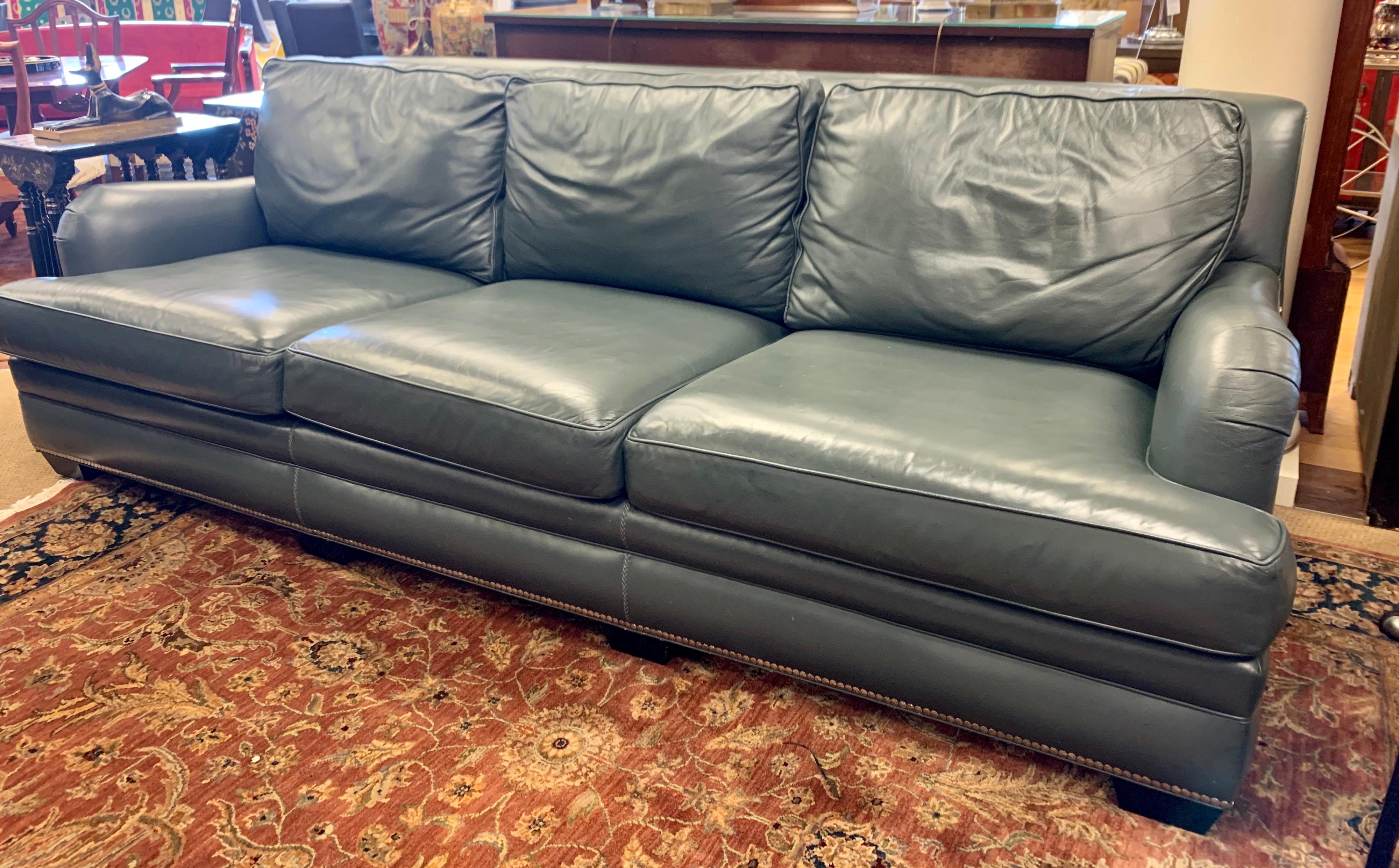 Extra large signed Hancock and Moore leather sofa with silver nailheads throughout.
The color of the leather is a blueish gray, Hancock and Moore's most coveted color.
The sofa is very large, measuring: 102