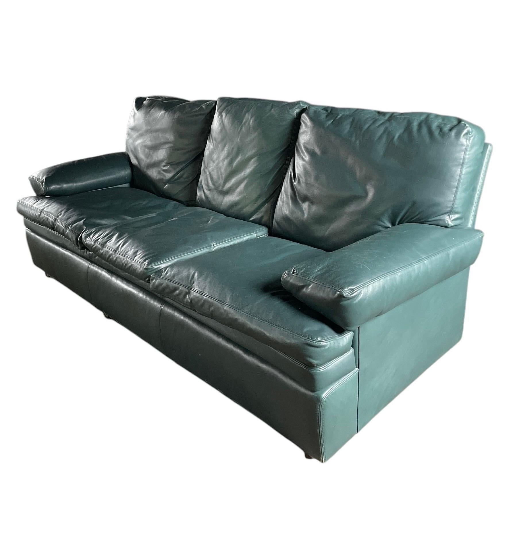 Gorgeous hunter green thick leather vintage Hancock & Moore classic couch. This sofa has many decades left and has that quality that only vintage leather has - with brass roller feet adorning the front the of the sofa with the most beautiful vintage