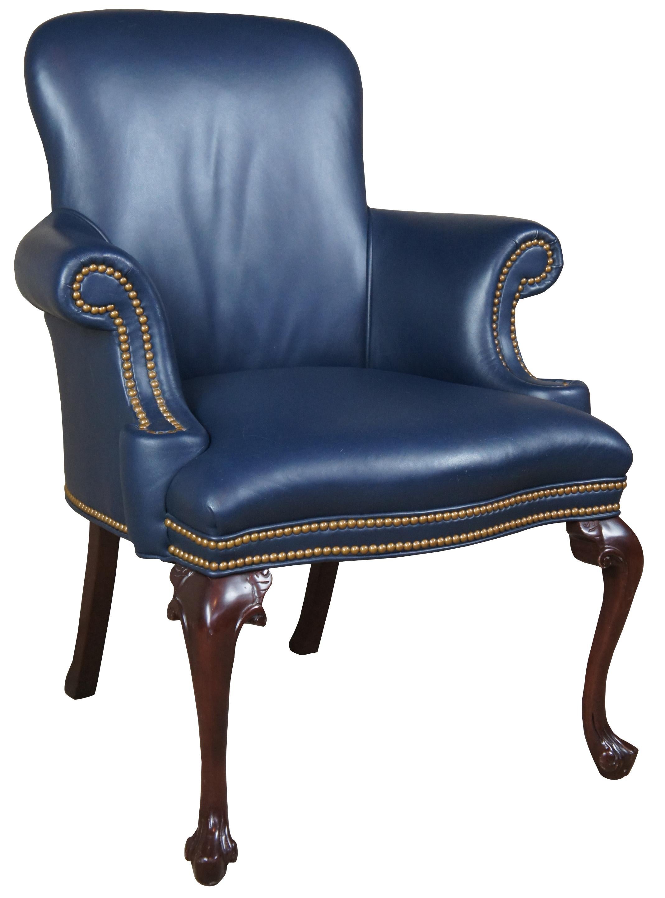 Hancock & Moore Garrett armchair. Queen Anne style with a distressed mahogany frame upholstered in Navy with nailhead trim. Great for use any library, office or living room. 
 