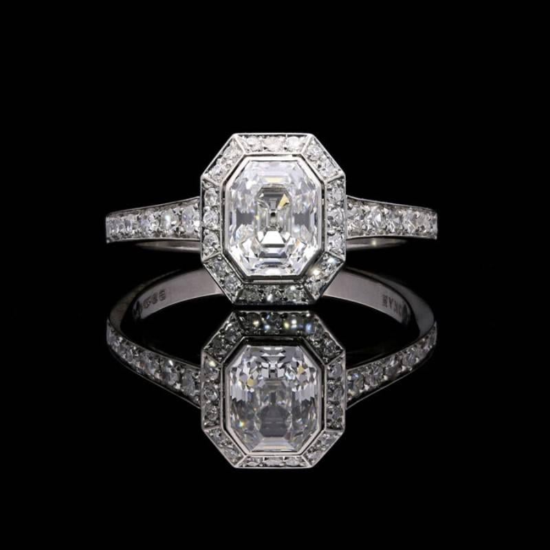 1.00 carat E VS1 old cut emerald cut diamond with GIA certificate
0.34 carats total of single cut diamonds.
Platinum with maker's mark and London assay marks
UK finger size L, US size 6
4.8 grams

A beautiful emerald-cut diamond ring by Hancocks,