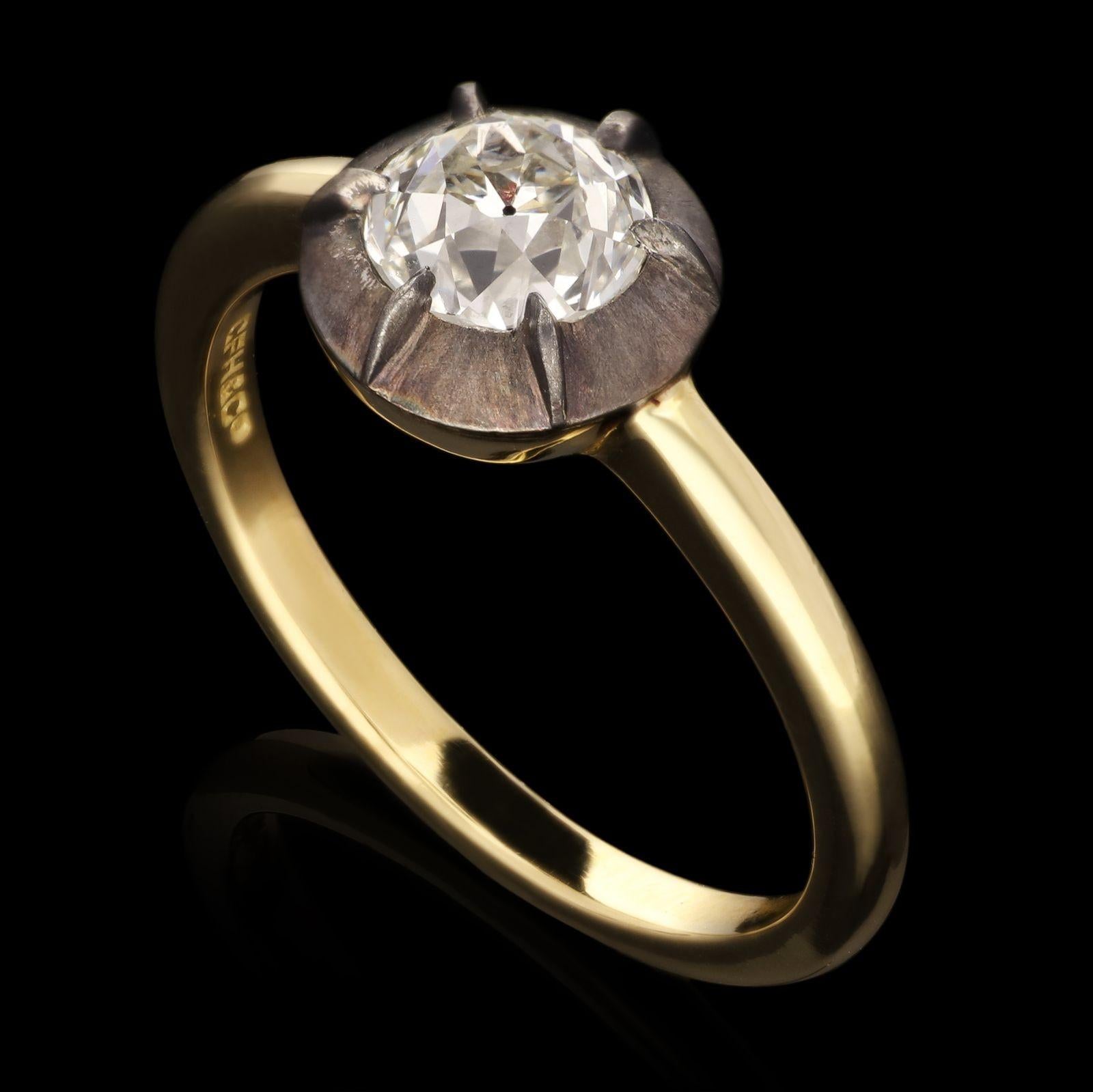 A beautiful old cut diamond ring in antique style setting by Hancocks, centred with a bright and lively old European brilliant cut diamond weighing 1.01cts and of G colour and VVS2 clarity in antique style handmade cut-down collet setting of black