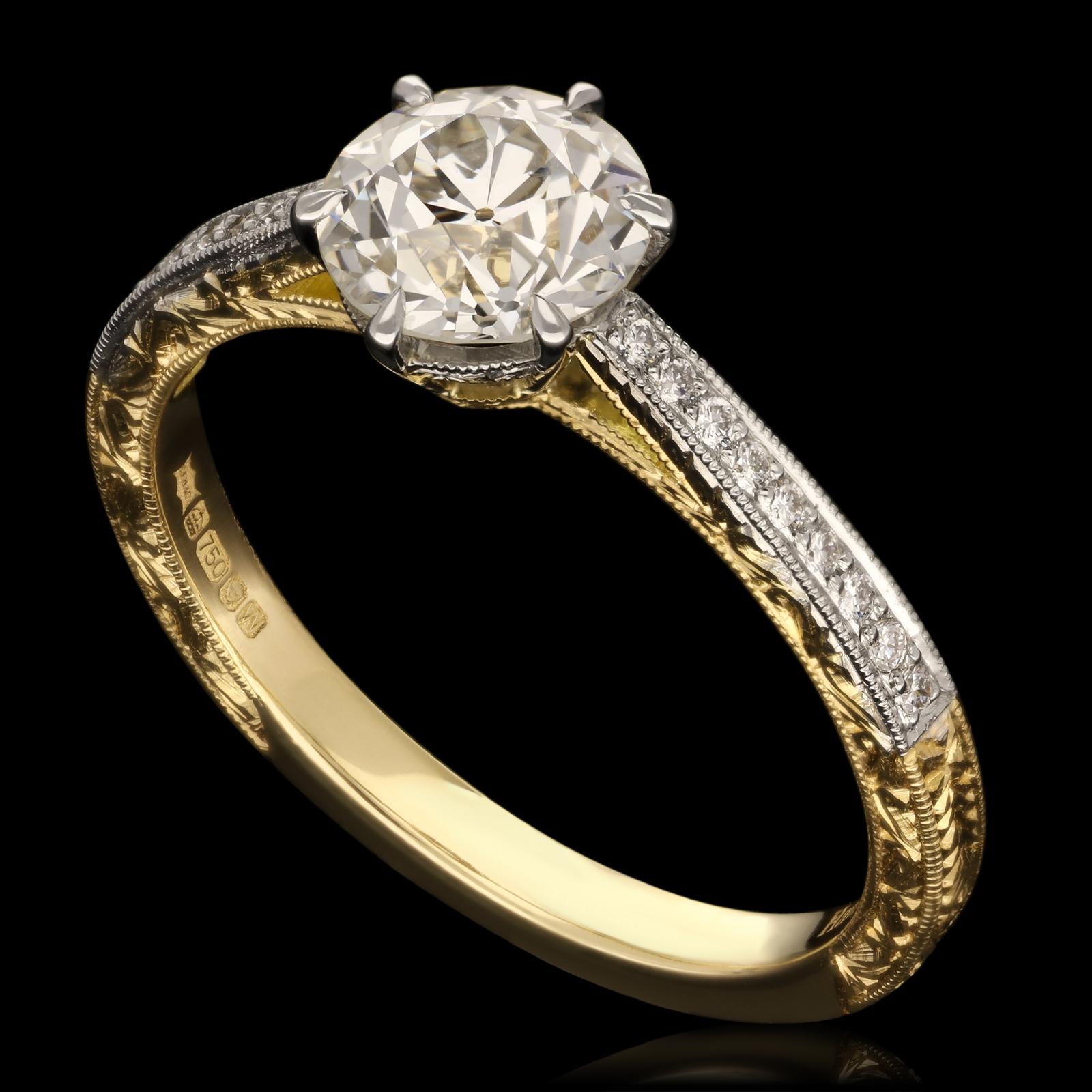An ornate old-cut diamond ring by Hancocks set to the centre with a bright and lively old European brilliant cut diamond weighing 1.05cts and of G colour and SI2 clarity in claw setting between tapering shoulders set with round brilliant cut