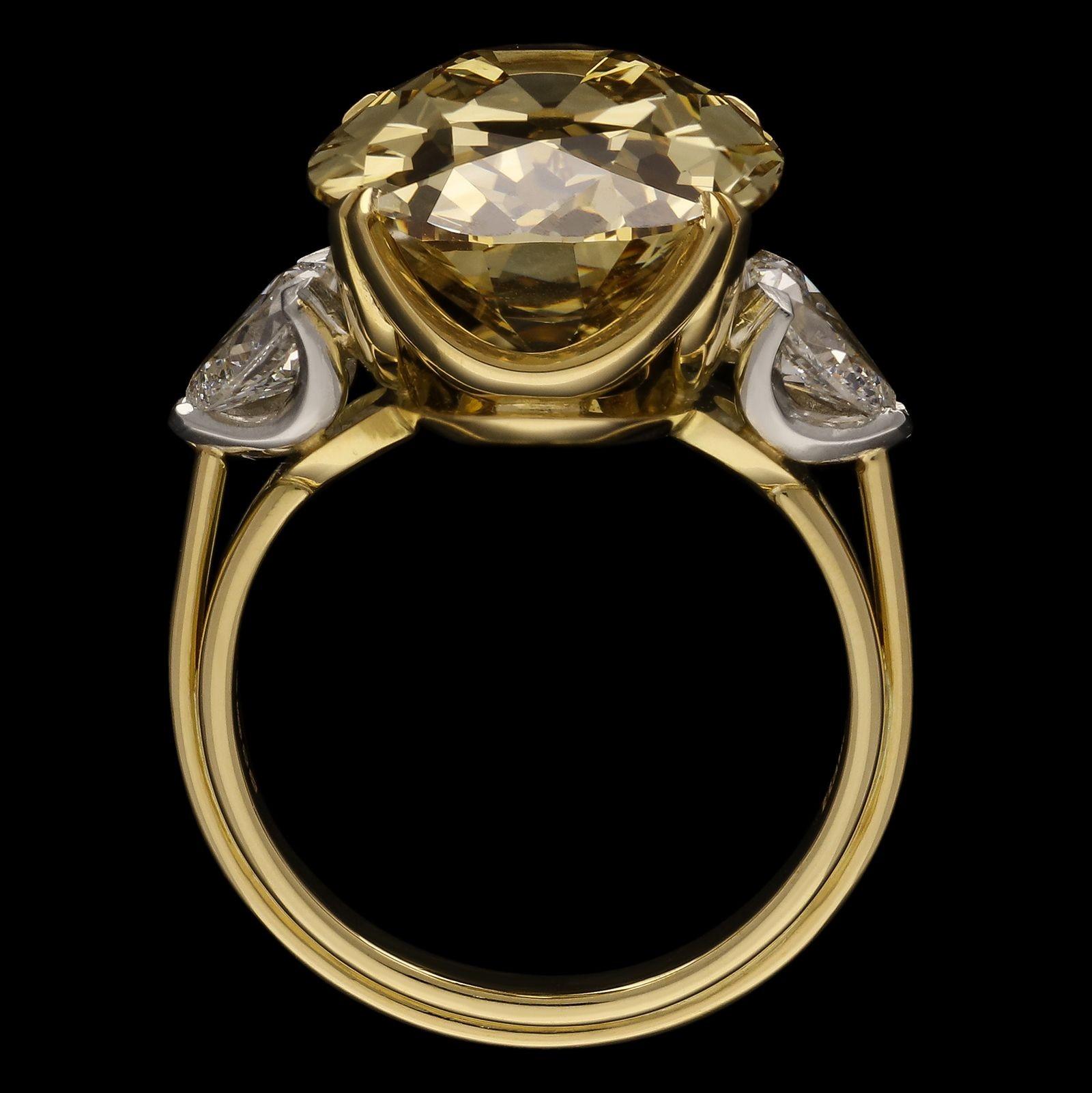 Description
A stunning fancy colour diamond ring by Hancocks, set with an oval shaped old cut diamond weighing 11.15cts and of Fancy Deep Brownish Yellow colour and VVS2 clarity claw set in 18ct yellow gold to an open scalloped gallery between