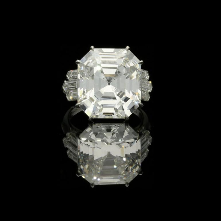 13.70ct I VS1 emerald cut diamond with GIA certificate 
6 bullet shaped diamonds weighing a combined total of 1.32cts
Platinum with maker's signature
UK finger size L, US size 6, can be adjusted to your own finger size
10 grams

An exceptional