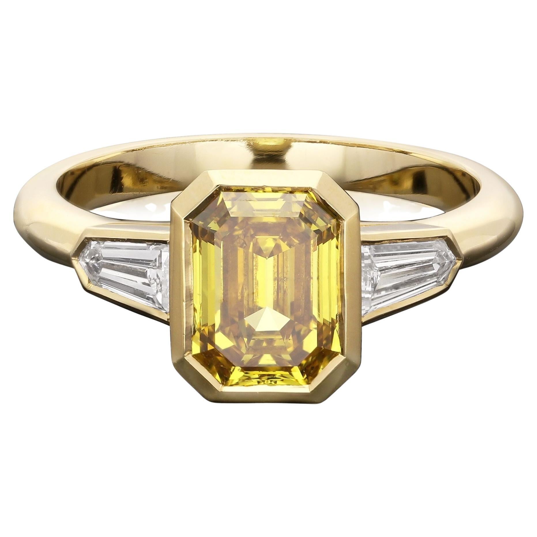 Hancocks 1.52ct Fancy Deep Yellow Diamond Ring with White Diamond Shoulders For Sale