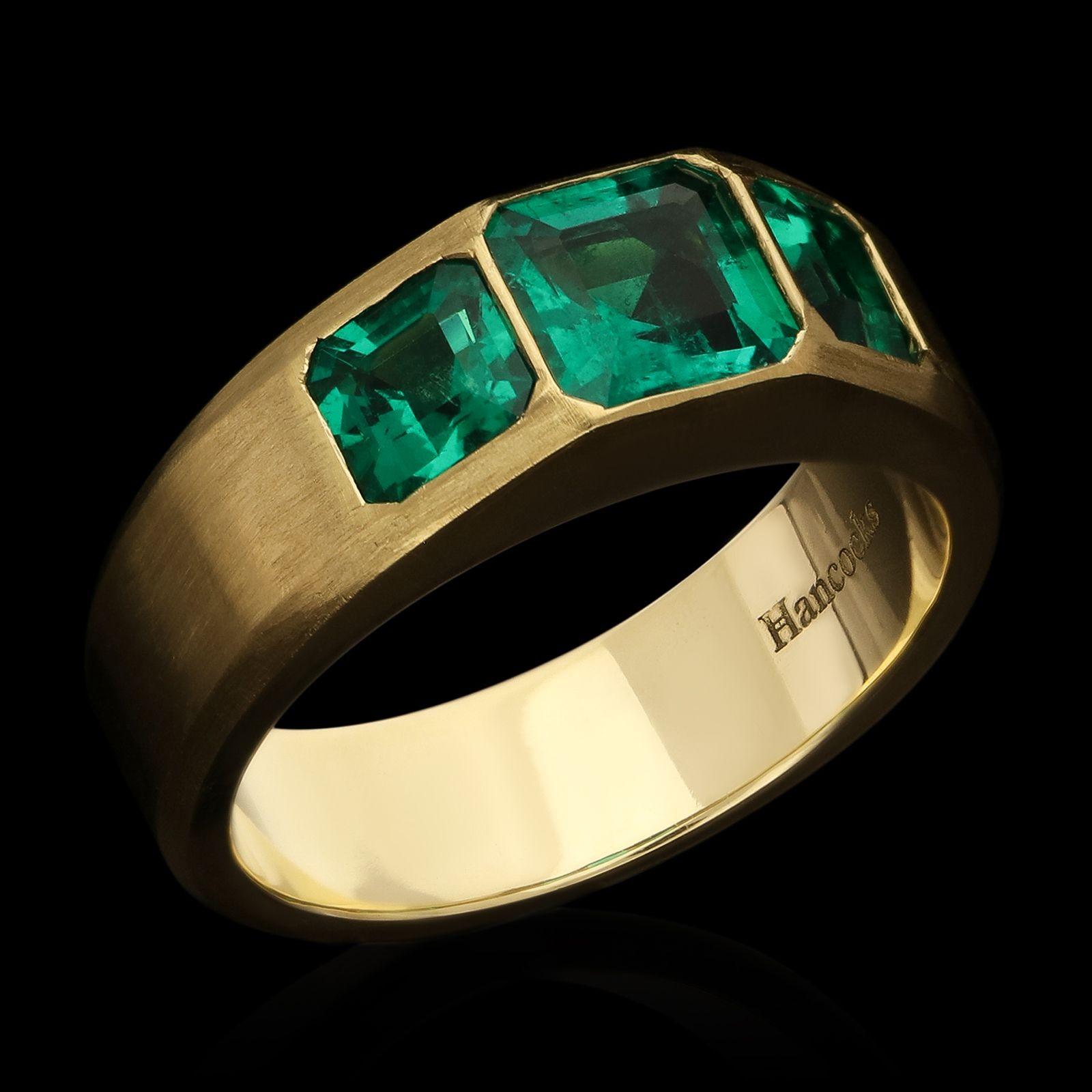 Emerald Cut Hancocks 1.54ct Colombian Emerald and 18ct Gold Three Stone Ring For Sale