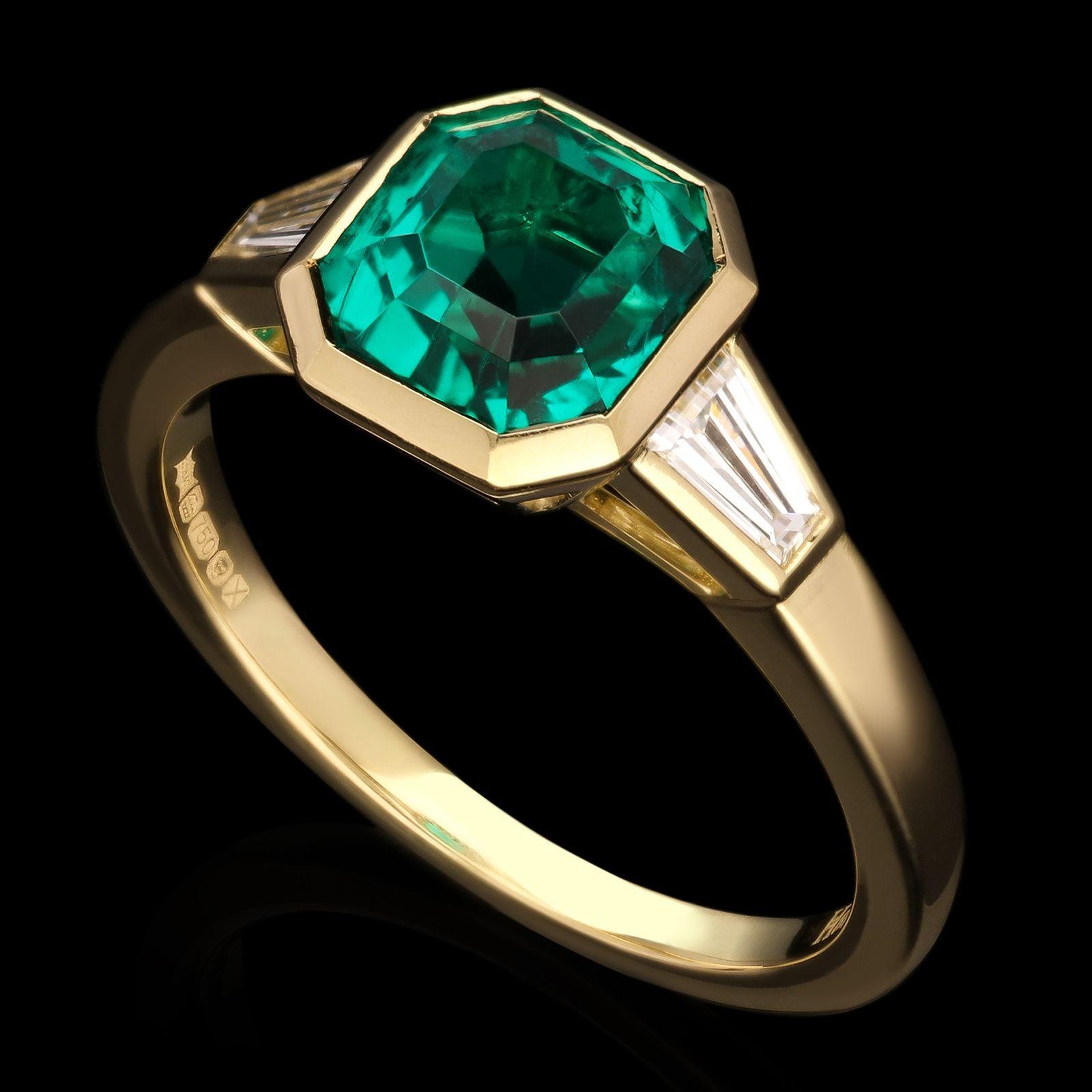 Emerald Cut Hancocks 1.83ct Colombian Emerald Ring in 18ct Gold Baguette Diamond Shoulders For Sale