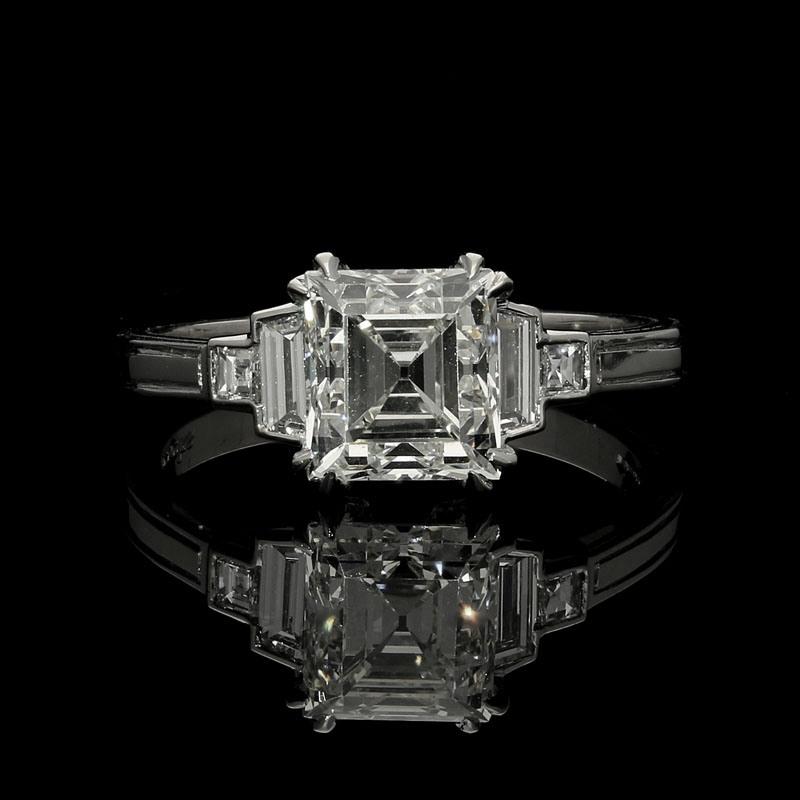 1.88ct G VS2 Vintage carre cut diamond with GIA certificate
2 x trapezoids and 2 x carre cut diamonds weighing a combined total of 0.37cts
Platinum with maker's mark and London assay marks
UK finger size L, can be adjusted to your own finger