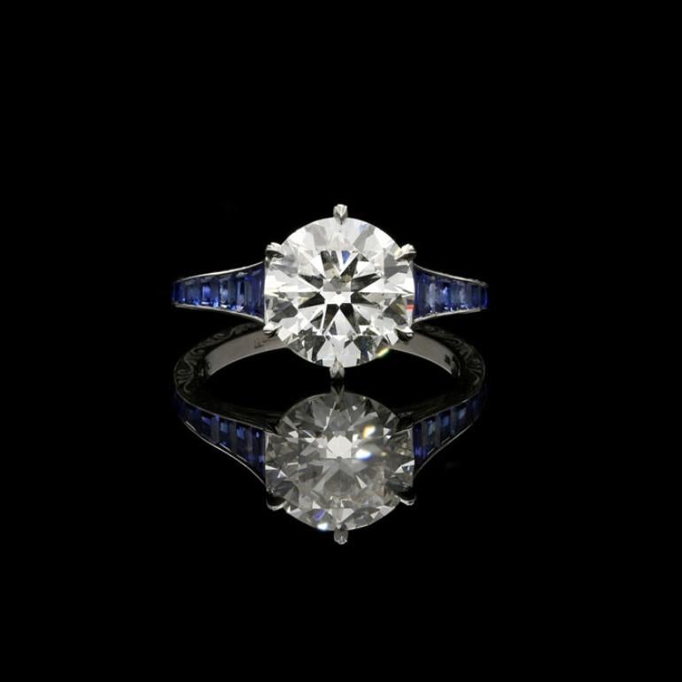 2.50 Carat I VS1 old European brilliant cut diamond with GIA certificate 
Calibre cut sapphires weighing a total of 0.59 Carats
Platinum with maker's signature
UK finger size K 1/2, US size 5.75, can be adjusted  your own finger size
4.1 grams

A