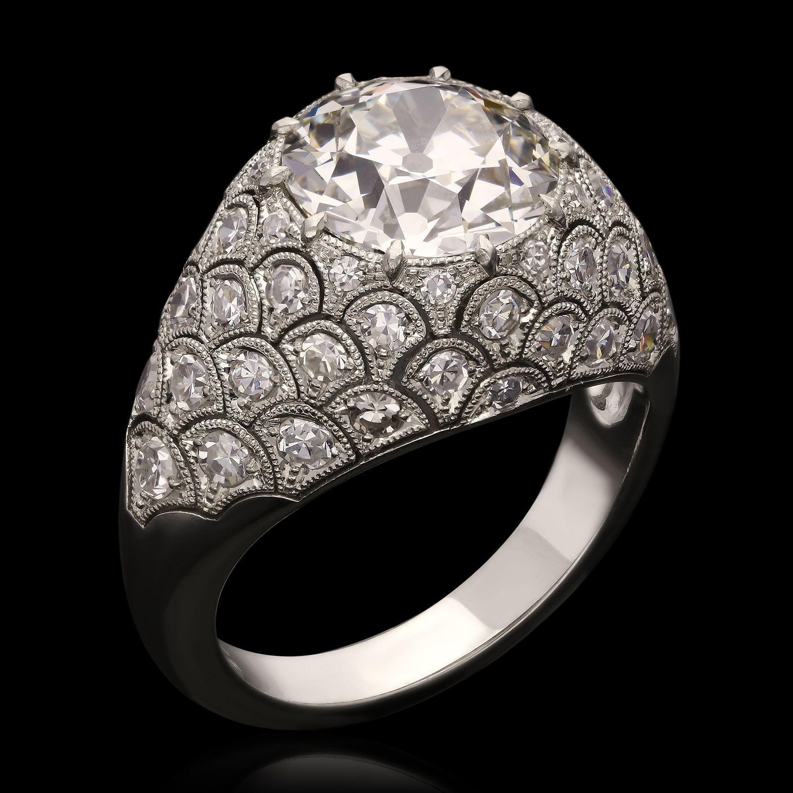 A beautiful old cut diamond bombe ring by Hancocks, centred with a bright and lively old European brilliant cut diamond weighing 3.12ct and of I colour and VVS2 clarity claw set within a beautiful bombe-style handmade platinum mount exquisitely