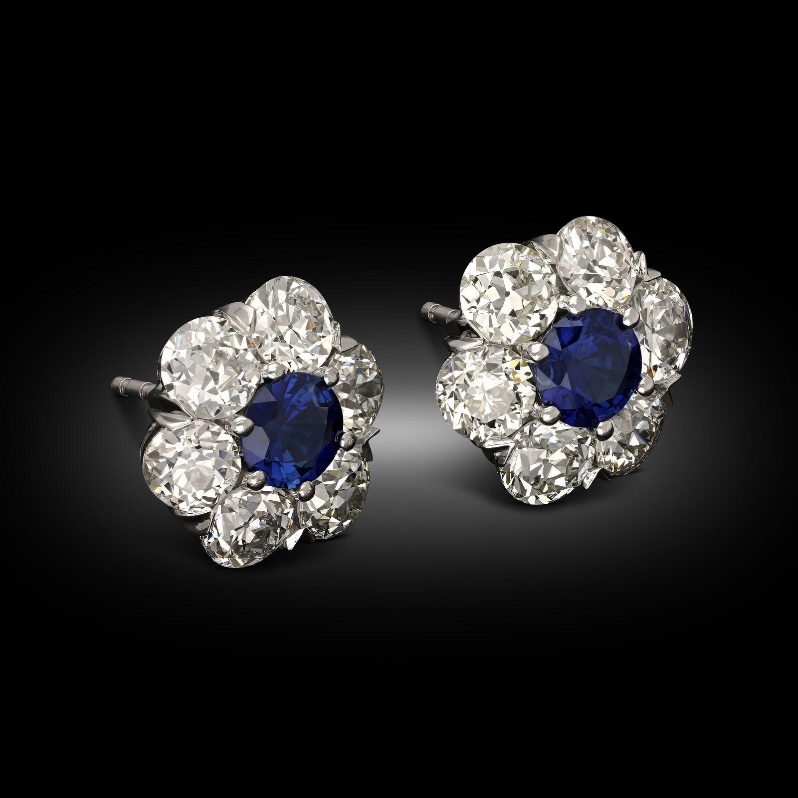 Maker:
Hancocks
Summary:
3.63ct Diamond & Sapphire Floral Cluster Earrings
Description:
A pair of old cut diamond and sapphire cluster stud earrings by Hancocks. To the centre of each earring is a round cut sapphire, surrounded by a cluster of six
