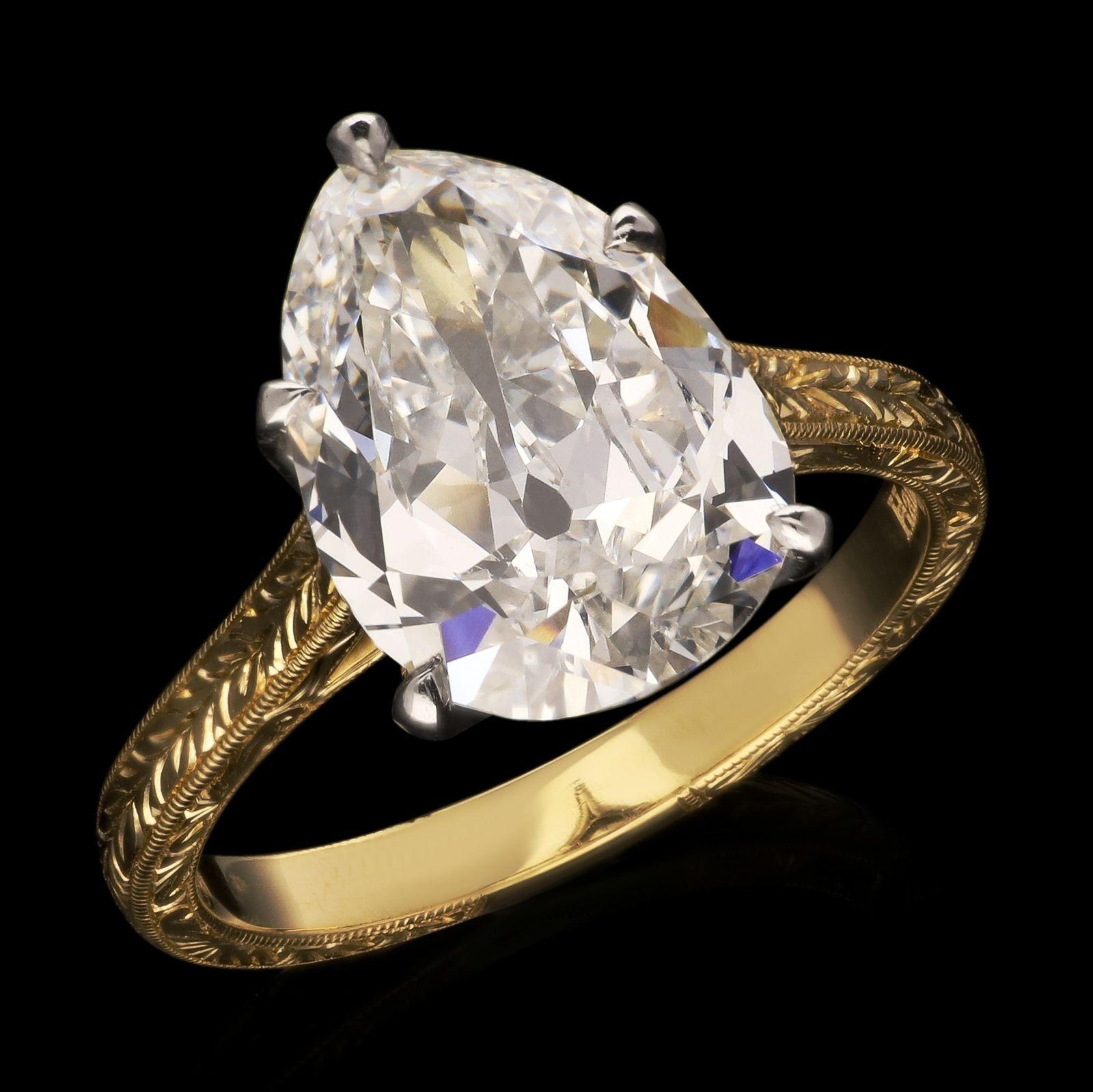 A stunning pear shape diamond solitaire ring by Hancocks, set with a wonderfully bright and lively old-cut pear-shaped diamond weighing 3.73ct and of G colour and VVS2 clarity, in a platinum five claw setting with scalloped gallery, all to a finely