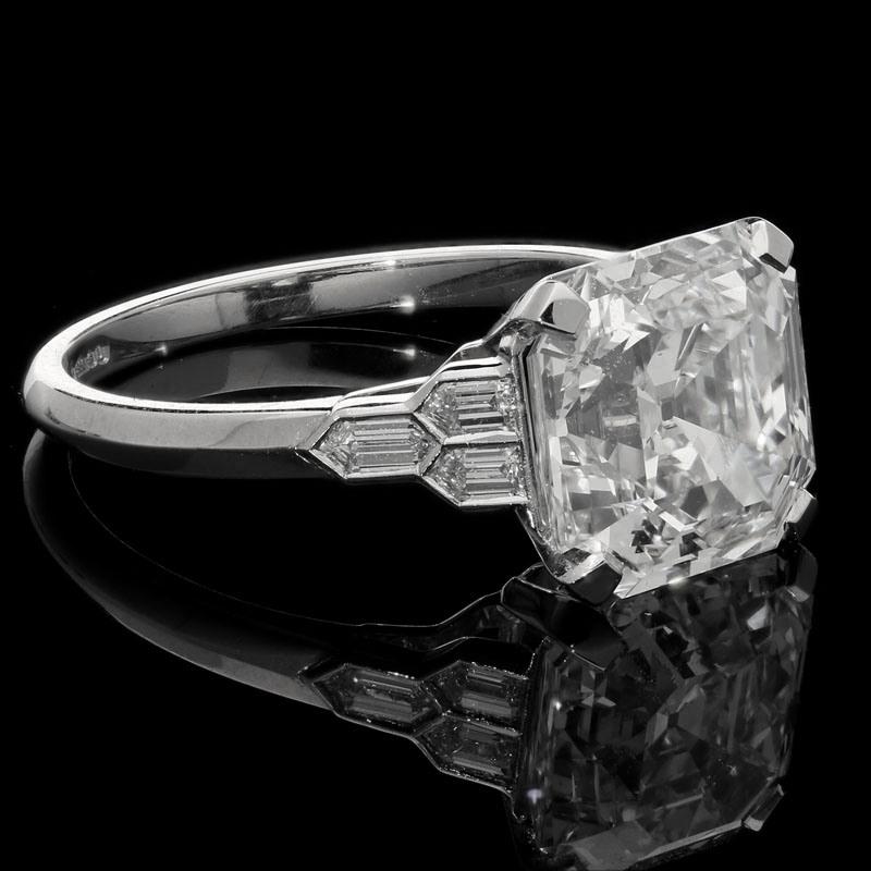 4.58 Carats G VS2 Asscher cut diamond with GIA certificate 
6 x matching grade bullet cut diamonds with a combined weight of 0.22 carats
Platinum with maker's mark and London assay marks
UK finger size M, can be adjusted to your own finger size
4.6